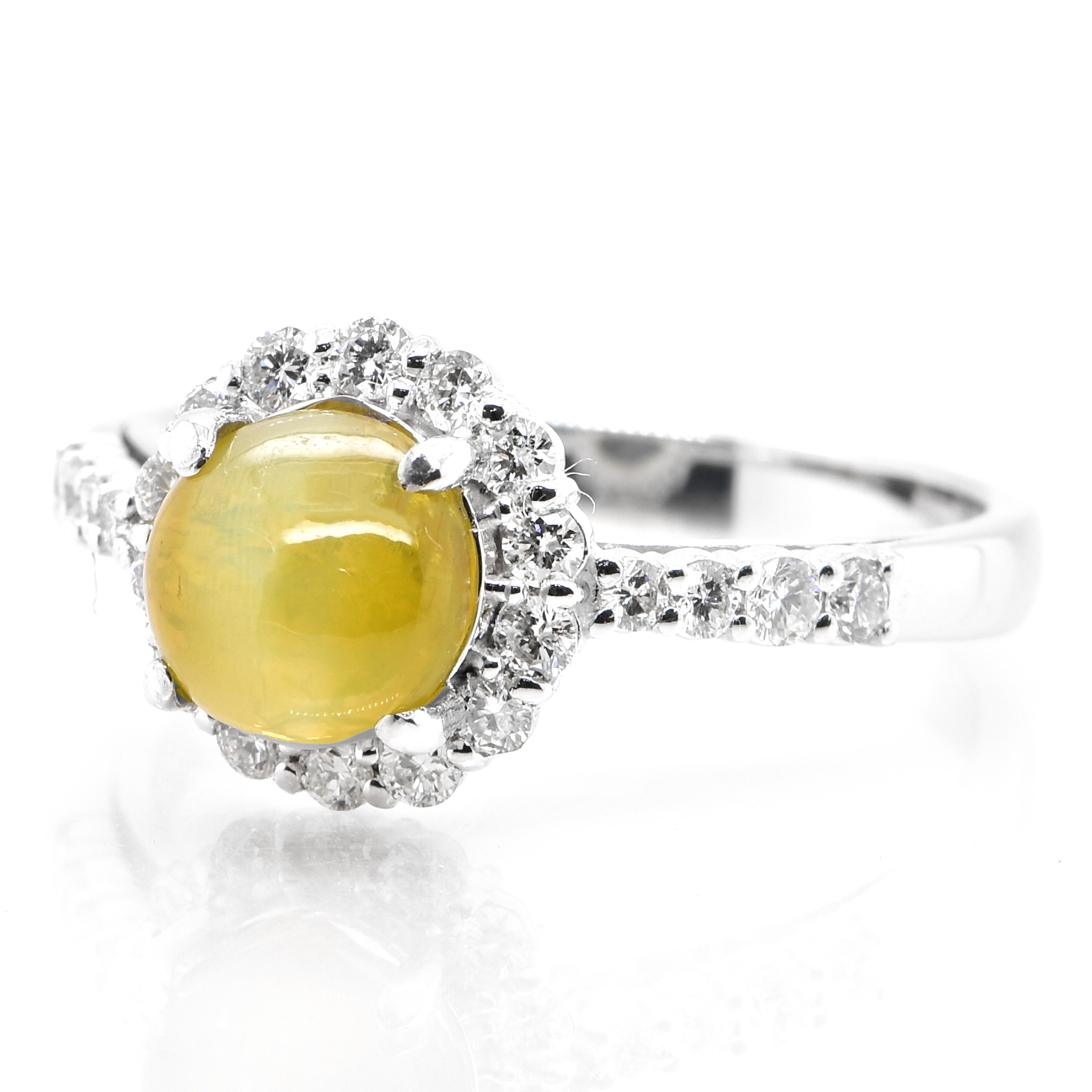 A stunning Ring featuring a 2.29 Carat Natural Cat's Eye Chrysoberyl and 0.41 Carats Diamond Accents set in Platinum. Cat's Eye Chrysoberyl exhibit a unique, naturally occurring phenomena called Chatoyancy or 