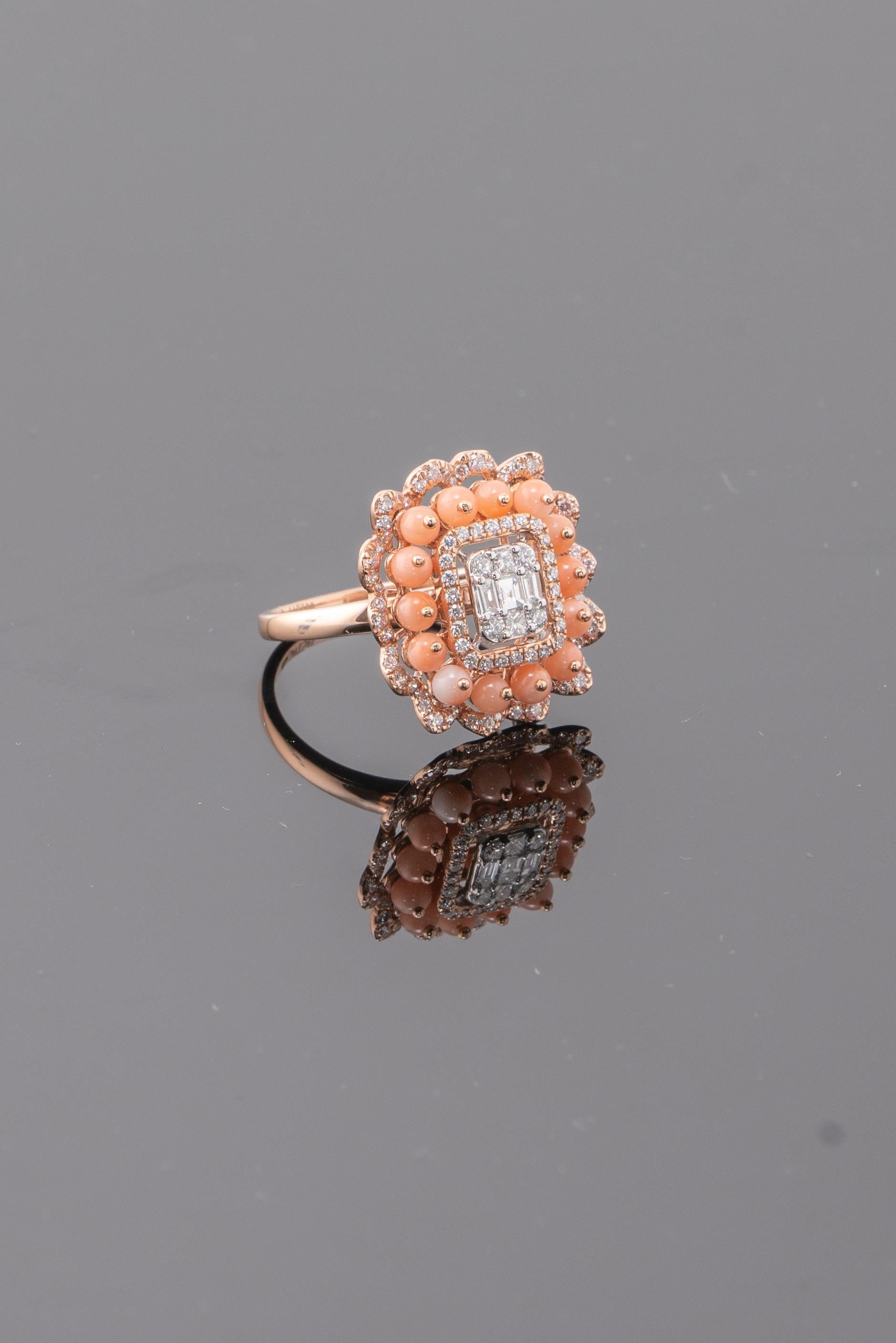 A unique ring which has few diamonds set intrinsically to make it look like like one whole piece , surrounded by round Italian corals and set in 18K Yellow . The craftsmanship of the the ring is second to none

The ring size is in US  Size 6 but can