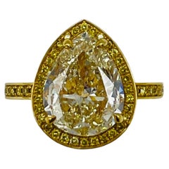 Retro 2.29 Carat Light Fancy Yellow Pear Shape Diamond Engagement Ring