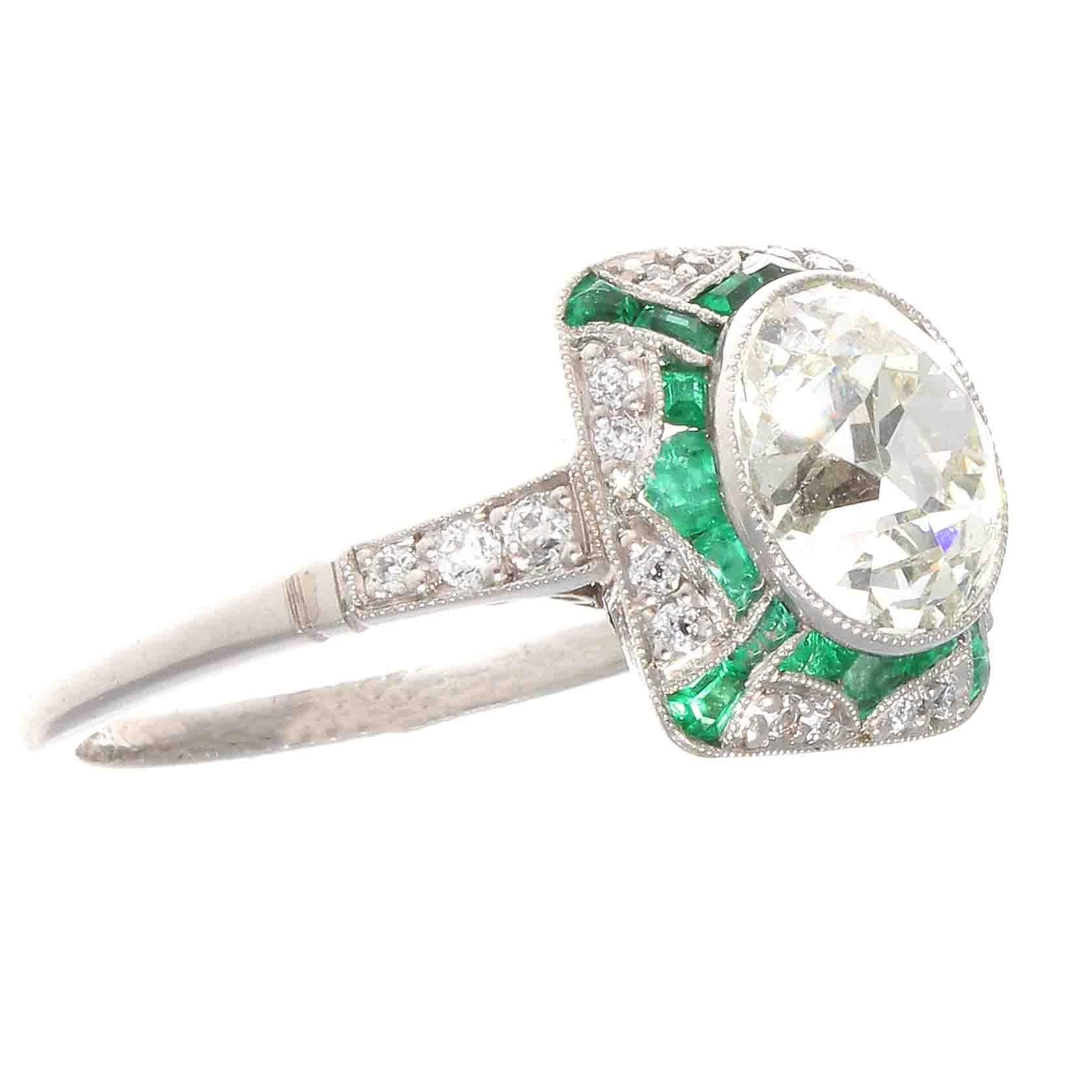 From the golden era of Art Deco jewelry when style and elegance mattered. A time when martinis tasted better and people dressed more fashionably. Featuring a 2.29 carat old European cut diamond that is J color, VS2 clarity. Accented by vibrant green