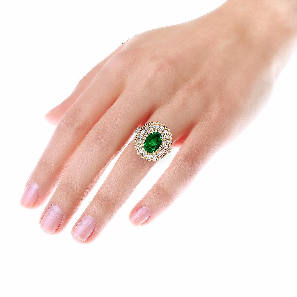 Romantic 2.29 Carat Oval Cut Emerald & Diamond Triple Halo 14 Karat White Gold Ring For Sale