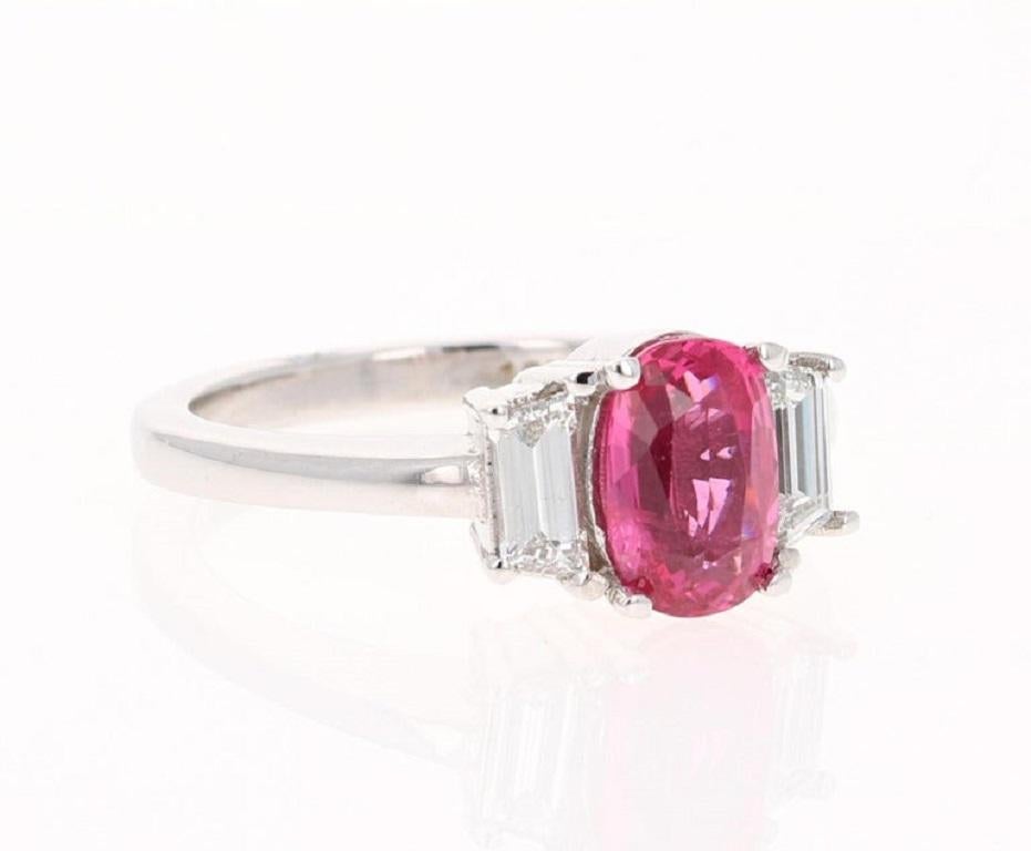 Calling all Spinel Lovers! 
The magnificent Oval Cut Spinel weighs 1.81 Carats and measures at 6 mm x 8 mm.  Surrounding the Spinel are Baguette Cut Diamonds that weigh 0.48 Carats. (Clarity: VS, Color: F)
The beautiful setting is curated in 18
