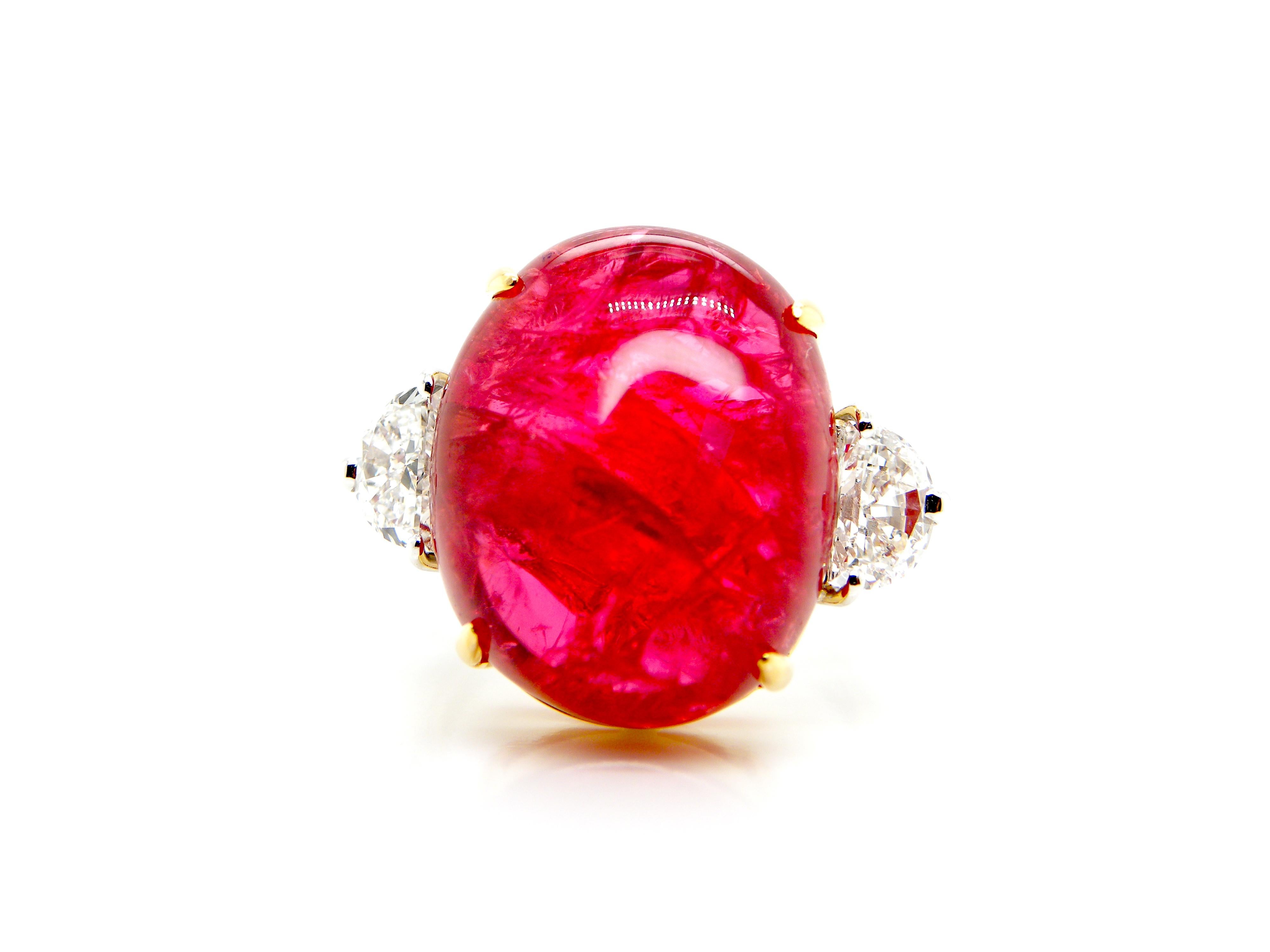 22.93 Carat GRS Certified Burma No Heat Vivid Red Spinel Cabochon Diamond Ring:

A very rare three-stone ring, it features a superb GRS certified unheated Burmese vivid red spinel cabochon weighing 22.93 carat flanked by super-white half-moon cut
