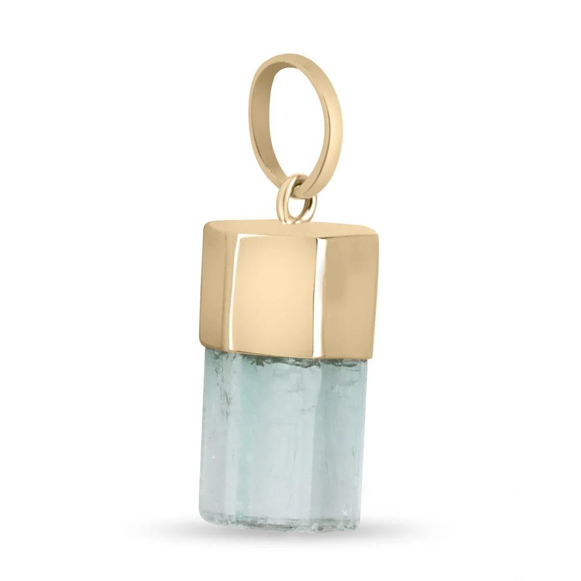 Showcased is a rare, single terminated natural Columbian emerald crystal gold pendant 14K. A genuine, Colombian emerald crystal is perfectly capped by smooth yellow gold. The piece has very good transparency and termination which is rare to have for