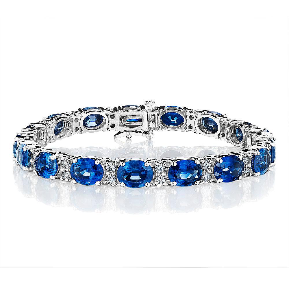 •	18KT White Gold
•	22.99 Carats
•	7” Long

•	Number of Sapphires: 17
•	Carat Weight: 21.70ctw
•	Stone Size: 8.0 x 6.0mm

•	Number of Round Diamonds: 34
•	Carat Weight: 1.29ctw

• A beautiful row of oval cut deep blue sapphires and white round
