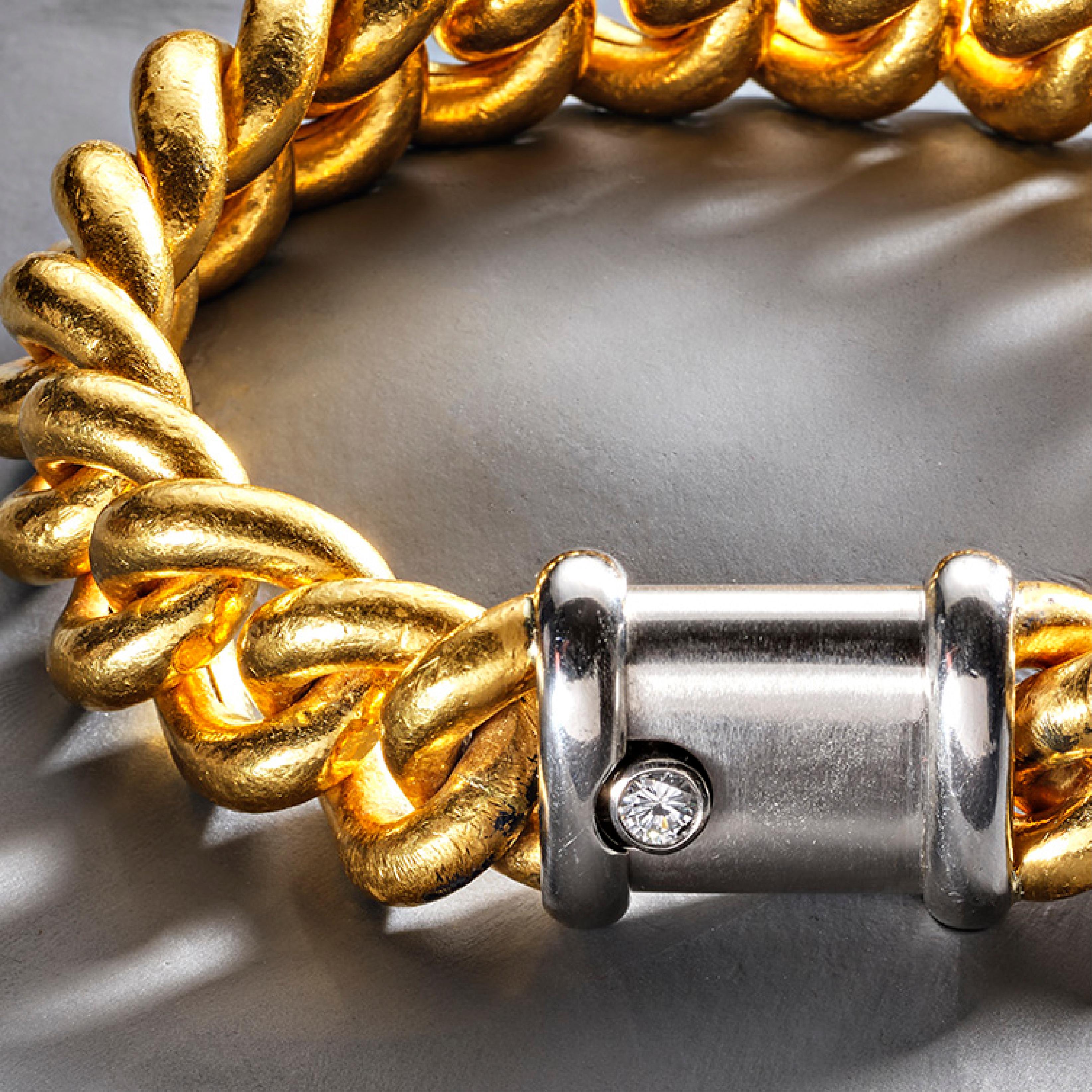 Exceptionally heavy curb link bracelet, with solid 22ct gold links and a platinum box clasp set with a round brilliant cut diamond.

This exceptional bracelet can easily be fitted to a smaller wrist size. 

Condition: As expected with 22ct gold, the