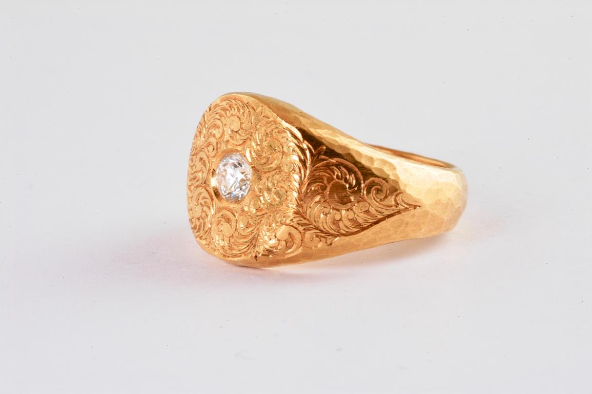 22ct gold signet ring with hand engraved detail and brilliant cut diamond 0.25cts hand made in Notting Hill London by renowned British jeweller Malcolm Betts. with its hand engraved detail its a one of a kind piece- Using ancient hand engraving
