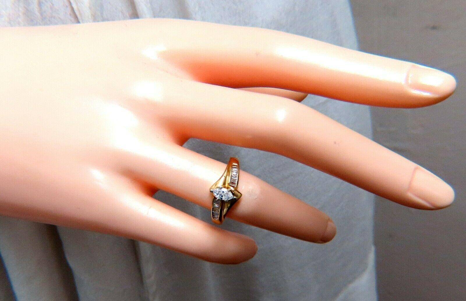 Marquise & Baguette Vintage Ring

.25ct Natural Marquise Cut Diamond 

& .28ct Side Baguettes

Center: 5.5 x 3.2mm

Si-2 clarity G color.

14kt yellow  gold

3.5 Grams

Overall ring: 9.2mm 

Depth: 7.4mm

Current ring size: 6.5

May professionally
