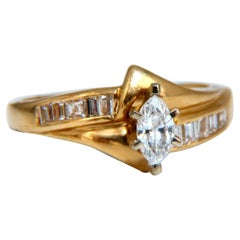 Bague en diamant naturel de taille marquise de 0,22 carat, 14 carats. Élevée au-dessus de