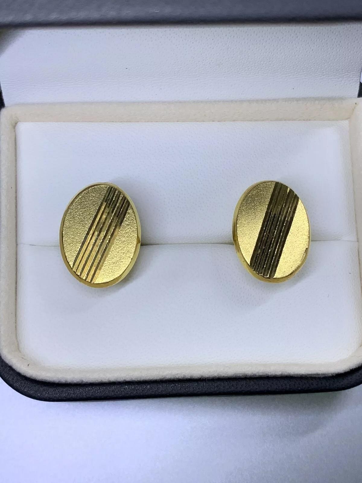 Gemelli da polso in oro giallo 22ct di forma ovale a tinta unita per uomo.