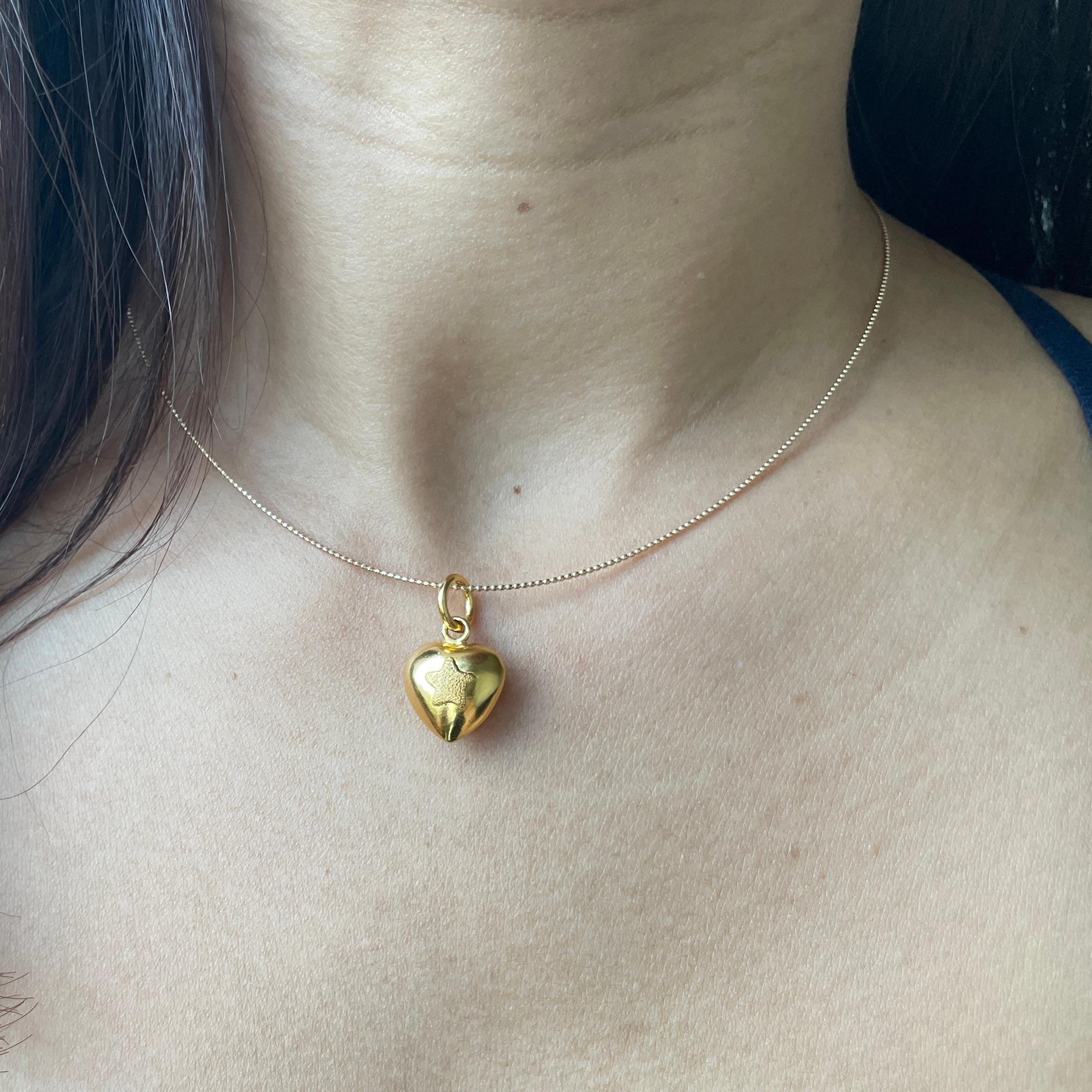 Capture hearts with this pure gold heart pendant!

Featuring a delicate textured star detail and classic romantic shape, this premium quality piece offers comfort perfect for layering or solo wear.

Whether it's a gift for someone special or a treat