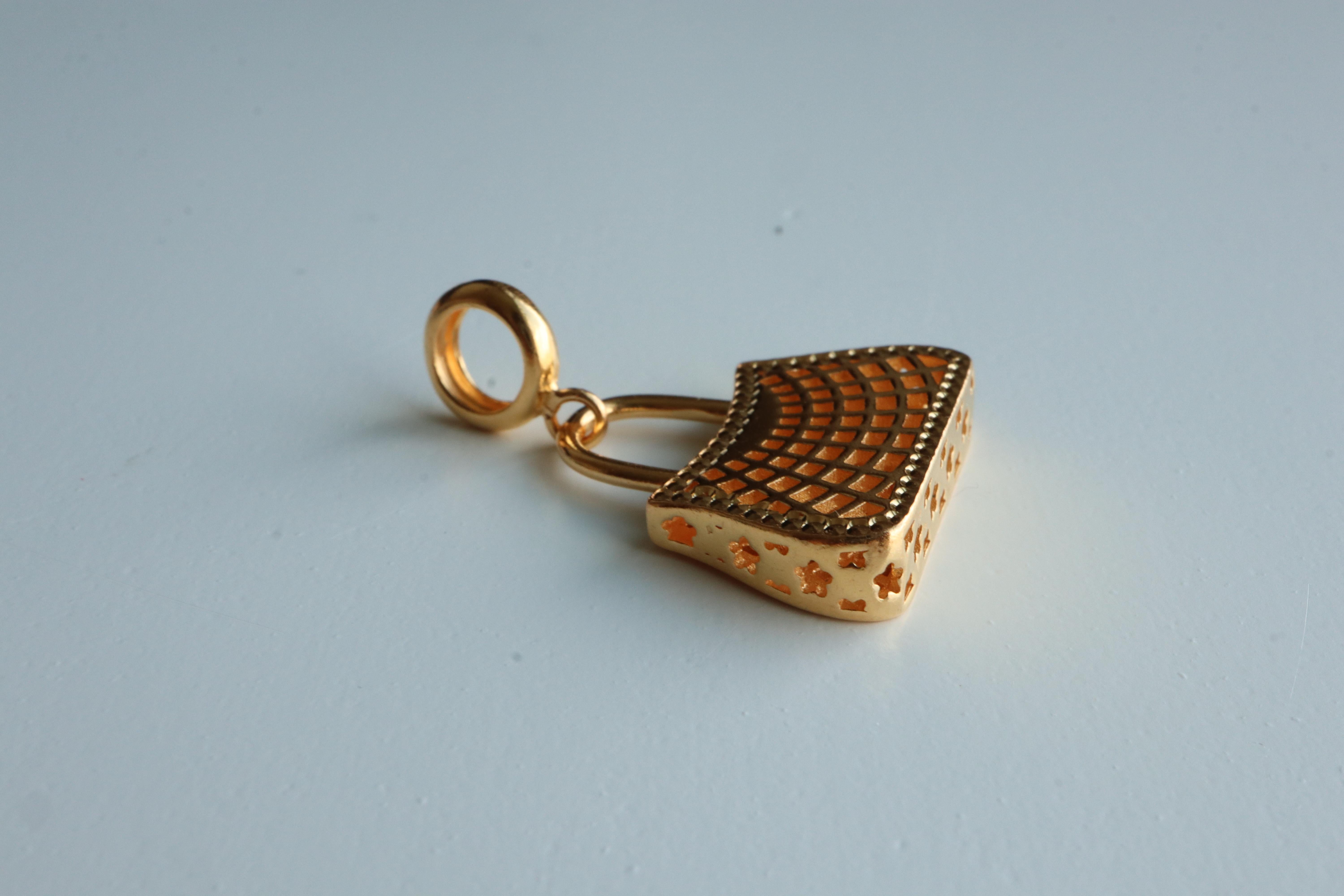 Gold Lucky Bag Charm

A stylish and meaningful piece symbolizing wealth, luck, and blessings. This gold bag design represents continuous fortune and financial security. In many cultures, it's seen as a charm to attract prosperity and protect your