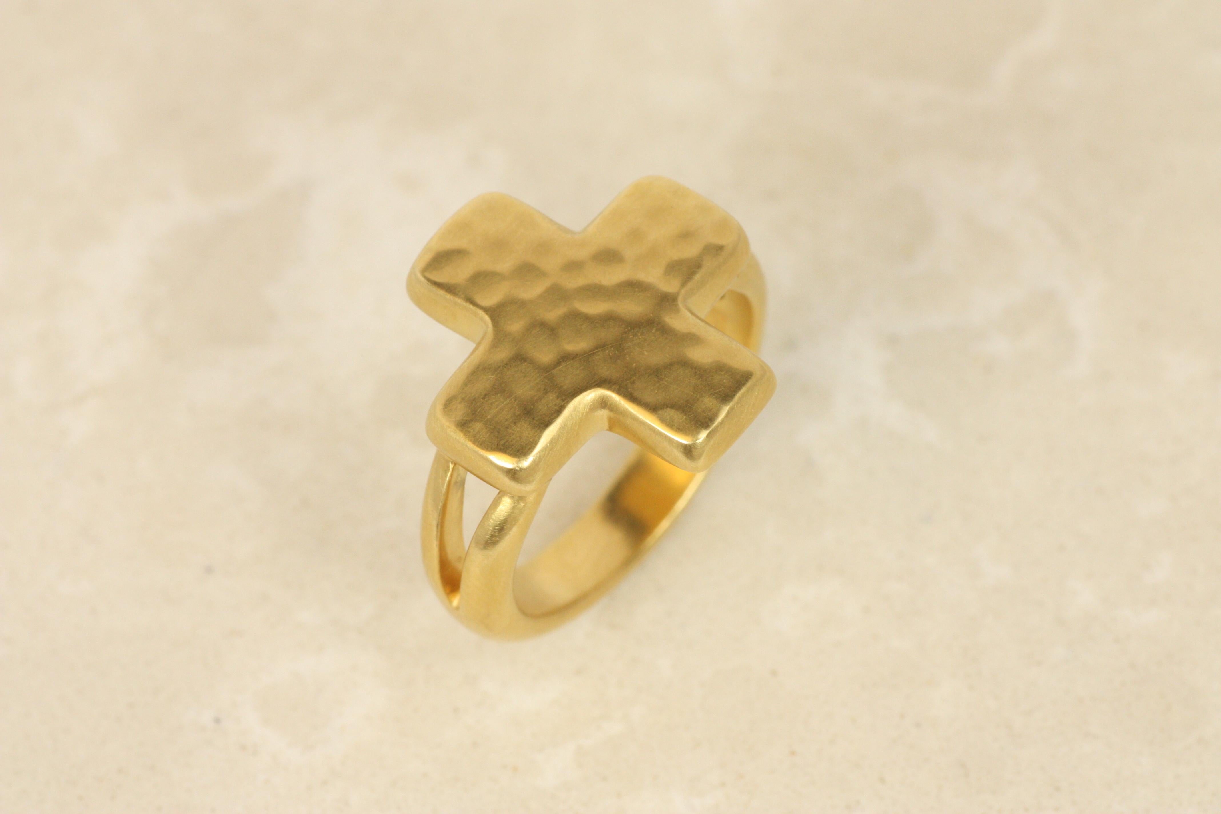 This symbolic cross ring, made for the Darlene deSedle collection, is a striking statement piece. Crafted from solid 22K yellow gold, it features a bold hammered top and open split-shank design that balances weight with comfort. This ring’s unique
