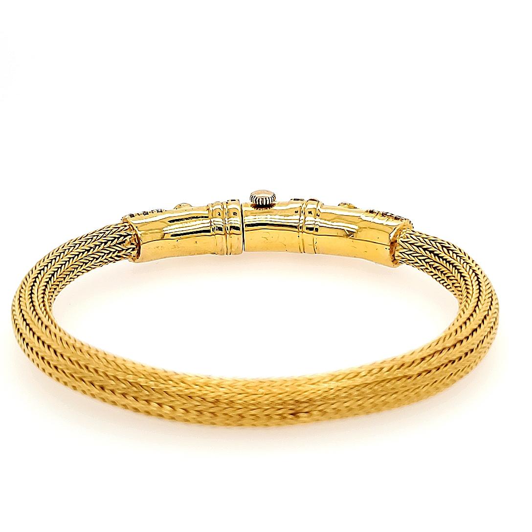 Soft Woven Bangle with Diamond Flower Motif and a Screw Closure in 22K Yellow Gold. The bangle is expertly set with (77) Round Brilliant Cut Diamonds approximately 2.09 carat total weight, G-H in color and VS in clarity. 7 1/4 inches inner