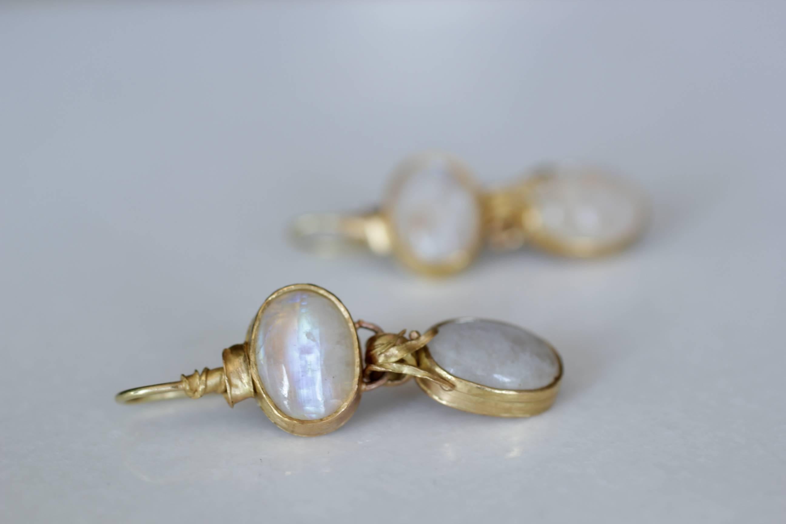Moonlight Earrings. Beautiful one-of-a-kind handmade 21K gold dangle drop earrings set with moonstones, inspired by the organic shapes of the sea and blades of grass. Feminine and elegant, these earrings will surely start a conversation.

The
