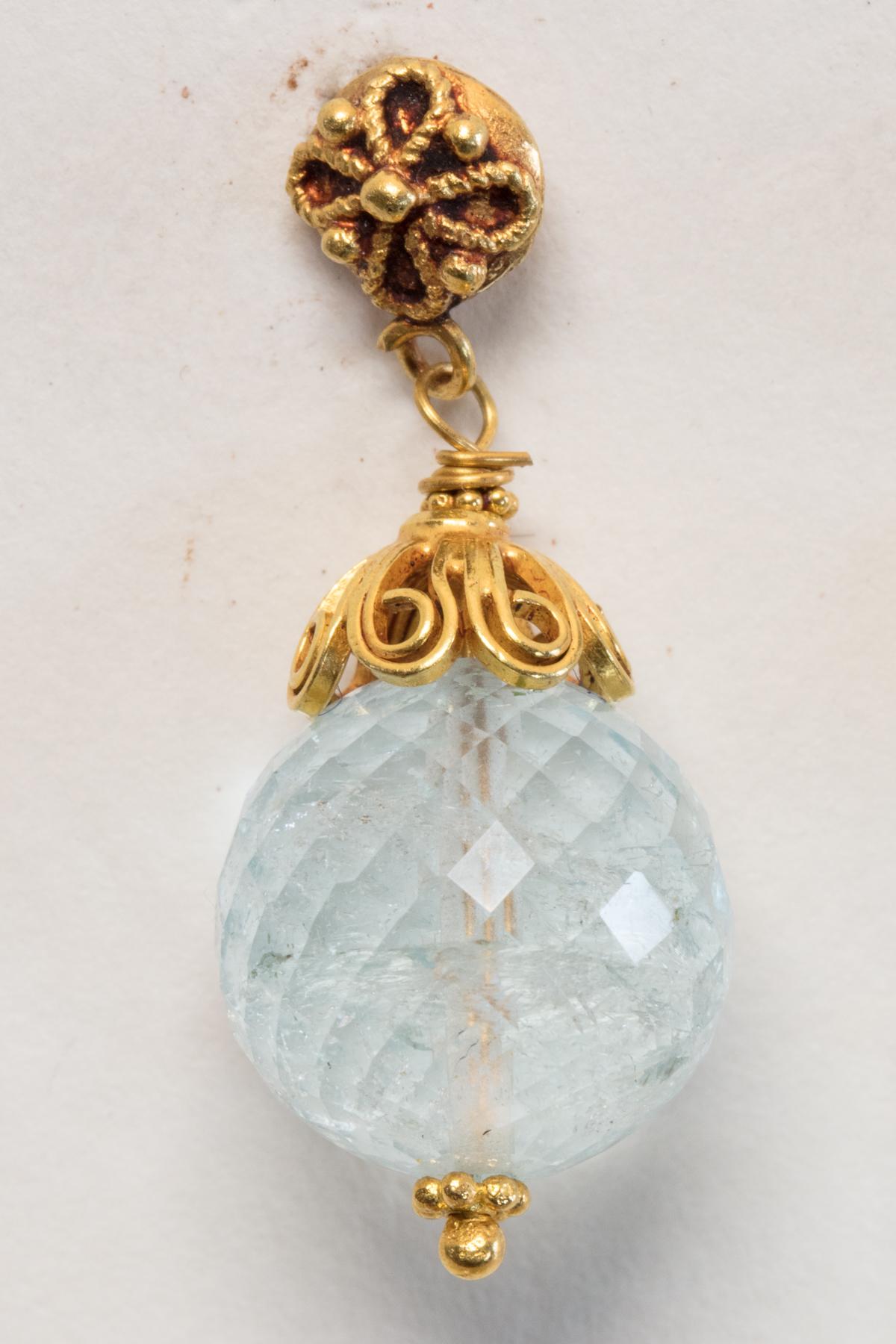 22K gold with fine wire work details and a large 13mm, faceted aquamarine drop.  Aquamarine has excellent color and clarity.  18K gold post for pierced ears.  By Deborah Lockhart Phillips.