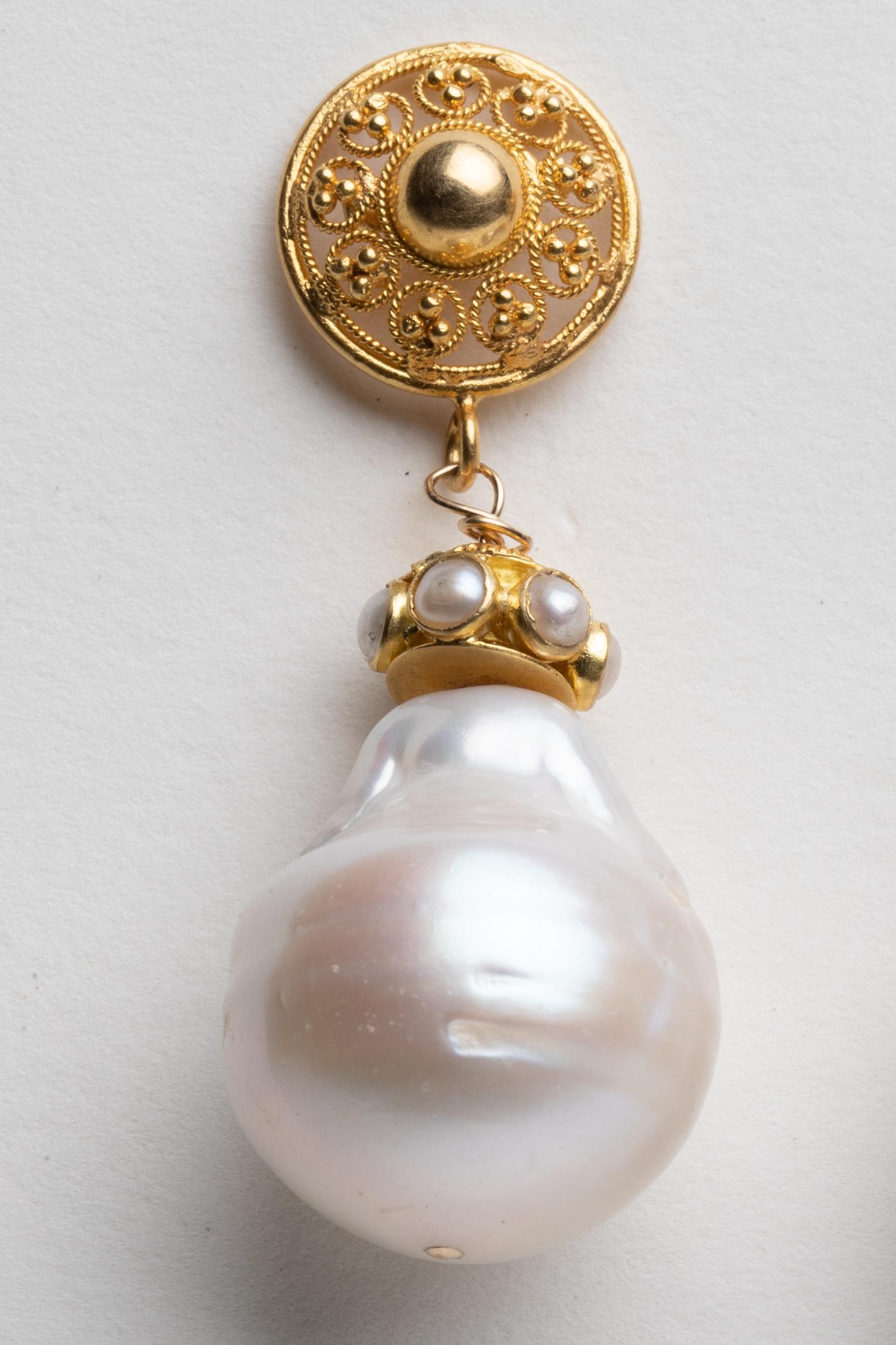 A pair of 22K gold and baroque pearl drop earrings.  Pearls measure 17mm and earrings feature 22K and pearl rondelles and fine tooling and granulation work on the post.  For pierced ears.  By Deborah Lockhart Phillips.