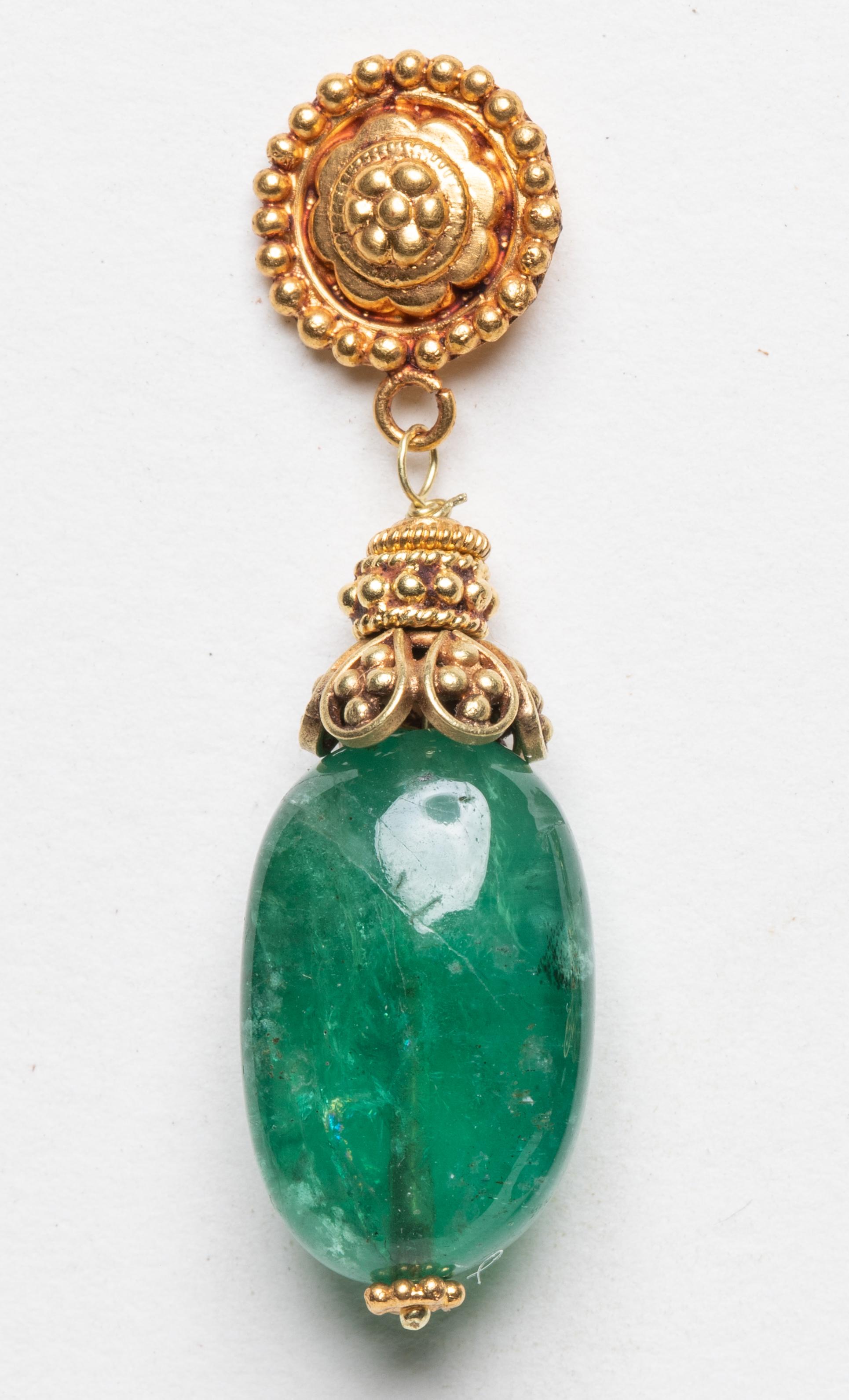 A pair of drop dangle earrings with large tumbled emeralds of excellent color.  The 22K gold work features fine granulation work on both the post and end cap.  For pierced ears.  Designed by Deborah Lockhart Phillips.