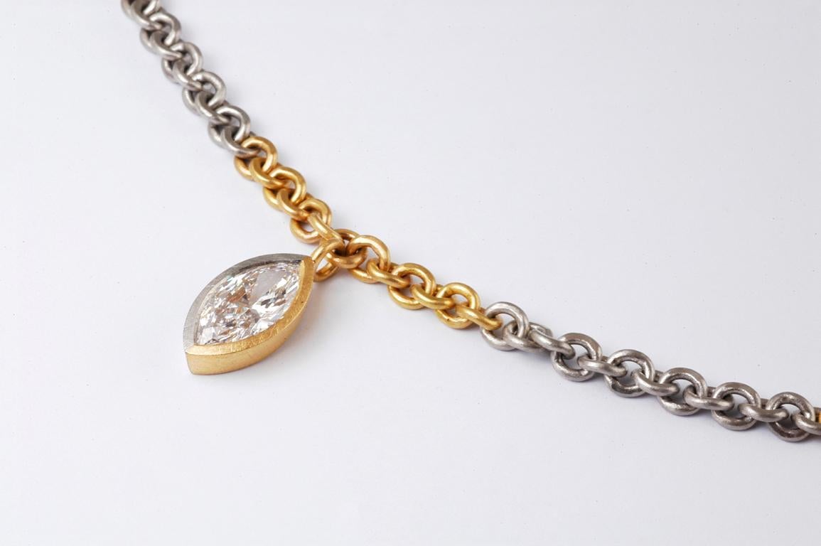 22ct gold and platinum link necklace with platinum and 22ct gold set marquise diamond 1.50cts D VVS1 GIA CERTIFIED. handmade in Notting Hill London by renowned British jewellery designer Malcolm Betts.

Each link of the chain is handmade in our