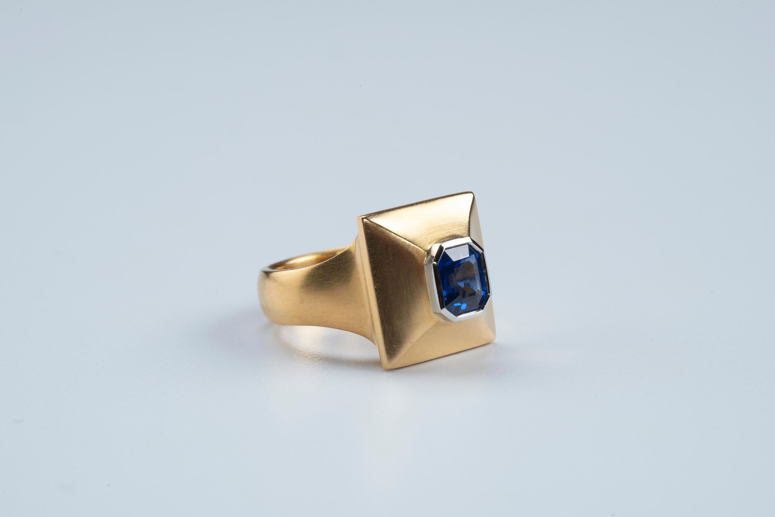 Color, composition and craft: this ring celebrates all three to the fullest. This beautiful, brilliant blue  1.34 ct emerald-shaped sapphire is nestled in a platinum bezel atop a carefully sculpted mound of 22k Fairmined gold. I picked this sapphire