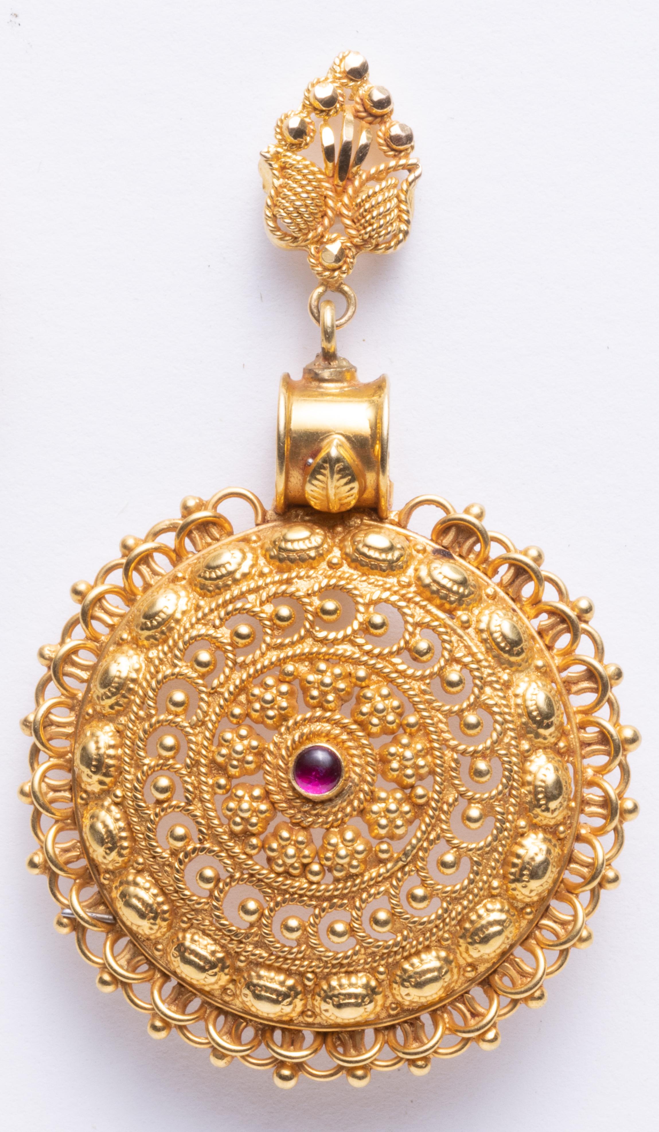 Lovely and rare 22K gold medallion earrings with highly intricate granulation and wire work.  A cabochon ruby center.  These were originally Indian necklace pendants and the top posts have been added to convert them to earrings which also features