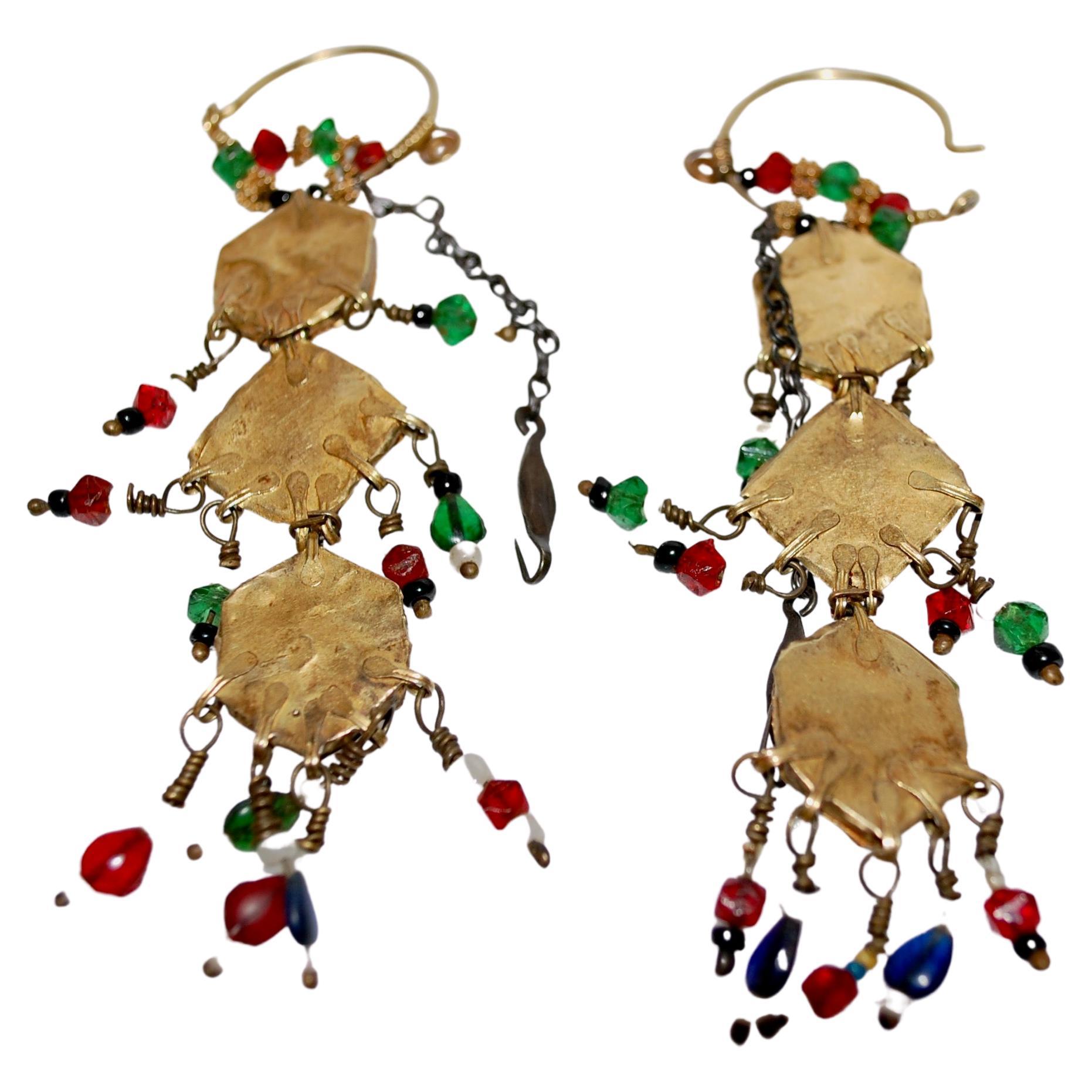 Rare Qajar 19th Century Persian 22k yellow gold and gemstones dangle bridal earrings. 
These fabules long earrings are hand crafted in 22 carat gold decorated with precious and semi precious stones, turquoise, rubies, emeralds, lapis lazuli.  Stones
