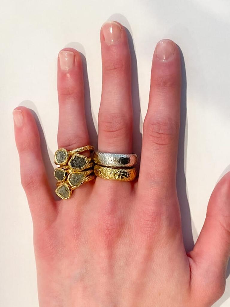 22k gold hand hammered, hand textured stacking rings are perfect when wanting to mix metals and stacking with other rings from our collection. Sold as a pair one silver one gold. Part of the Essentials Collection which is the ultimate in ease and