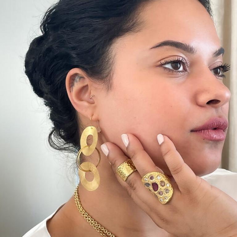 22k gold earrings are handmade and hand carved and one of a kind. Modern twist to the traditional hoop earring. They are lightweight, flirty, fun and flow freely. Part of the Essentials Collection is the ultimate in ease and beauty. Effortlessly