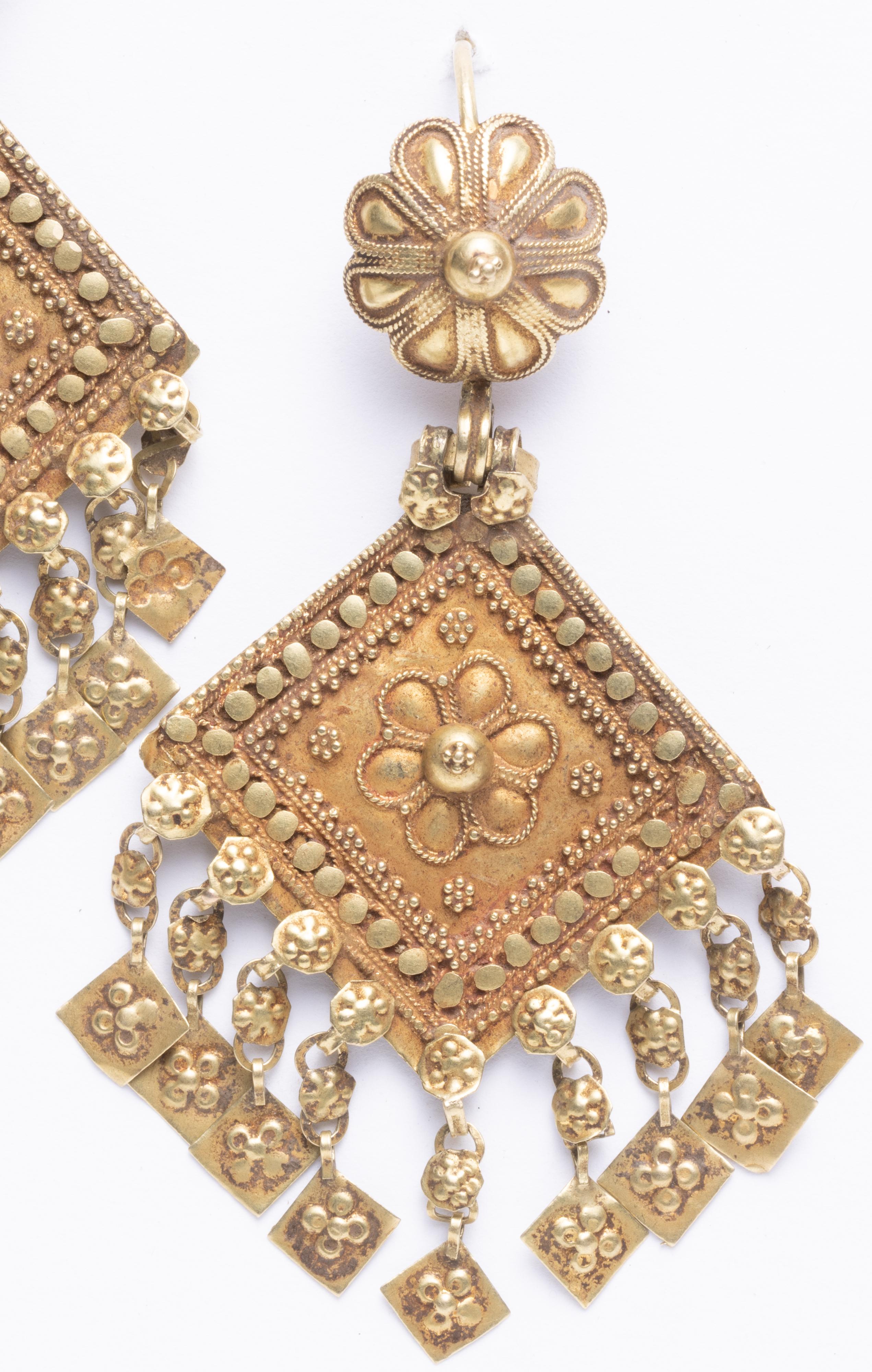 An exquisite pair of 22K gold Indian earrings from Gujarat.  Beautiful hand-tooling and granulation work indicative of the incredible Indian goldsmiths.  Dates to the early 1900's.  A gold French wire, for pierced ears only.