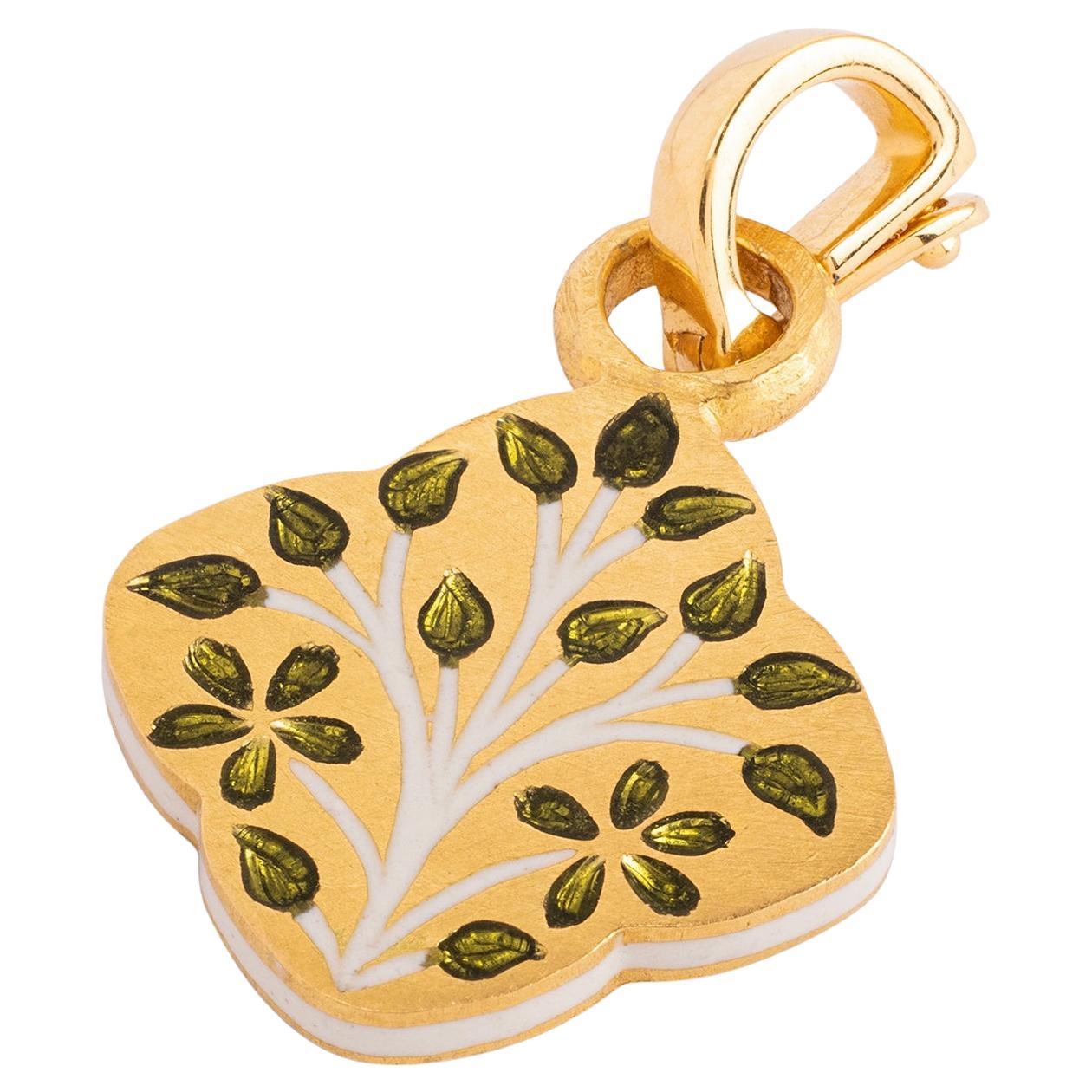 This 'Tree of Life' Clover Reversible Initial Mohur Charm is a modern heirloom that encapsulates the power of self-expression, a tangible representation of your individuality, and a precious keepsake to be cherished for generations to come. 

From
