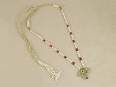 22K Gold Jadau jade pendant inlaid with gold, polki and rubies with bird motif