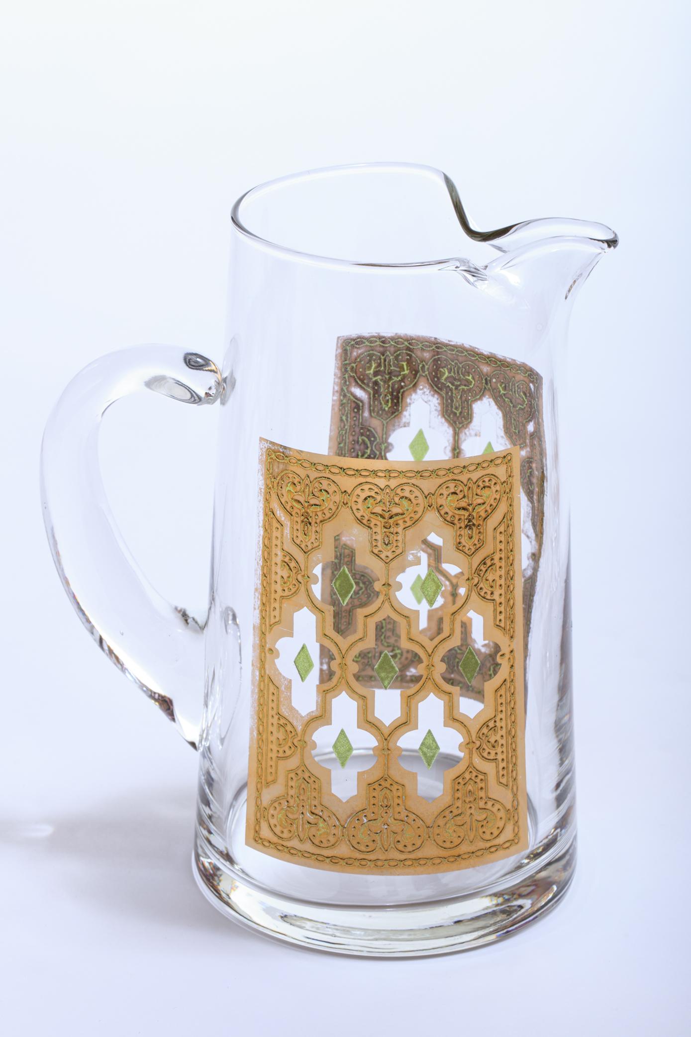 Beautiful Moroccan themed vintage beverage or water pitcher with pair of matching glasses, circa 1965. All pieces show no wear and are in great condition. This style was showcased in the feature film 