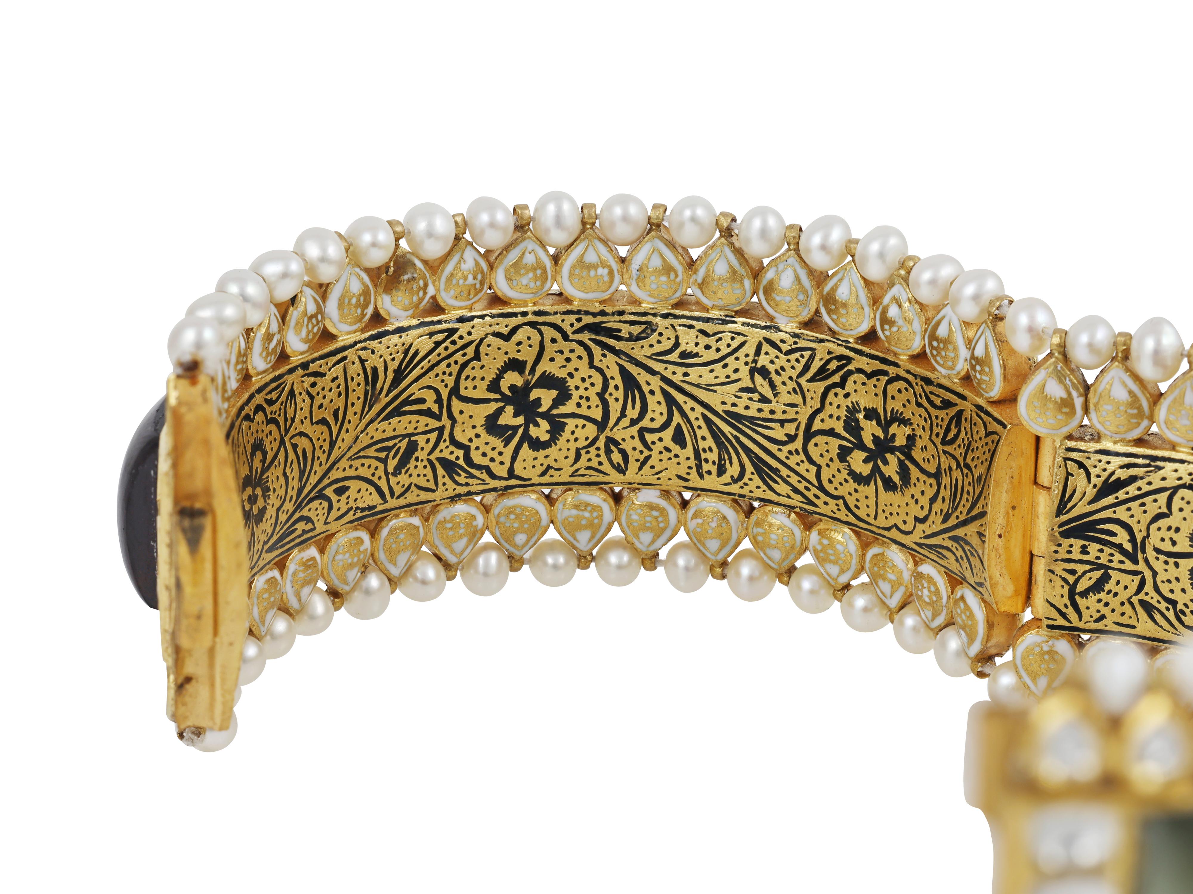This 22K gold bangle is set with one precious gemstones with eight of them being set in rectangular form which includes Emerald, Blue sapphire, Yellow Sapphire, Hessonite garnet, Cat's Eye, Coral, Pearl and Ruby. The ninth gemstone diamond are