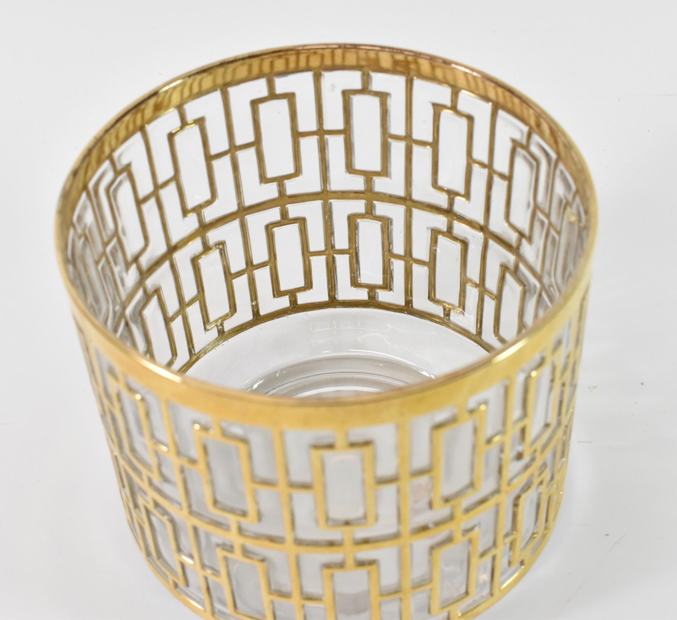 glass and gold ice bucket