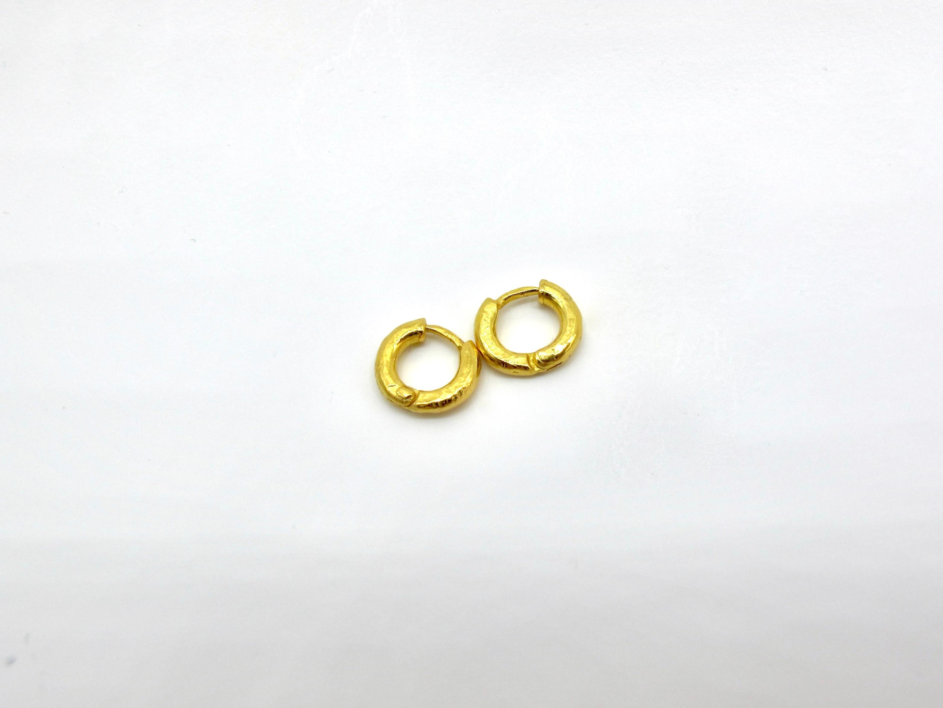 The perfect tiny hoops for gold and jewelry lovers who just want something sporty and everyday without foregoing a luxurious look and feel which 22k gold will always deliver on. Hand fabricated in 22k gold with visible construction joints, tool