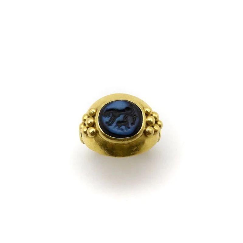 This 22k gold ring contains an Ancient Greek intaglio of a lion nursing her cub, carved into banded agate. Lions were often depicted in Greek imagery, but a nursing lion was rarely seen. This is a unique intaglio, and its details—the tiny paws,