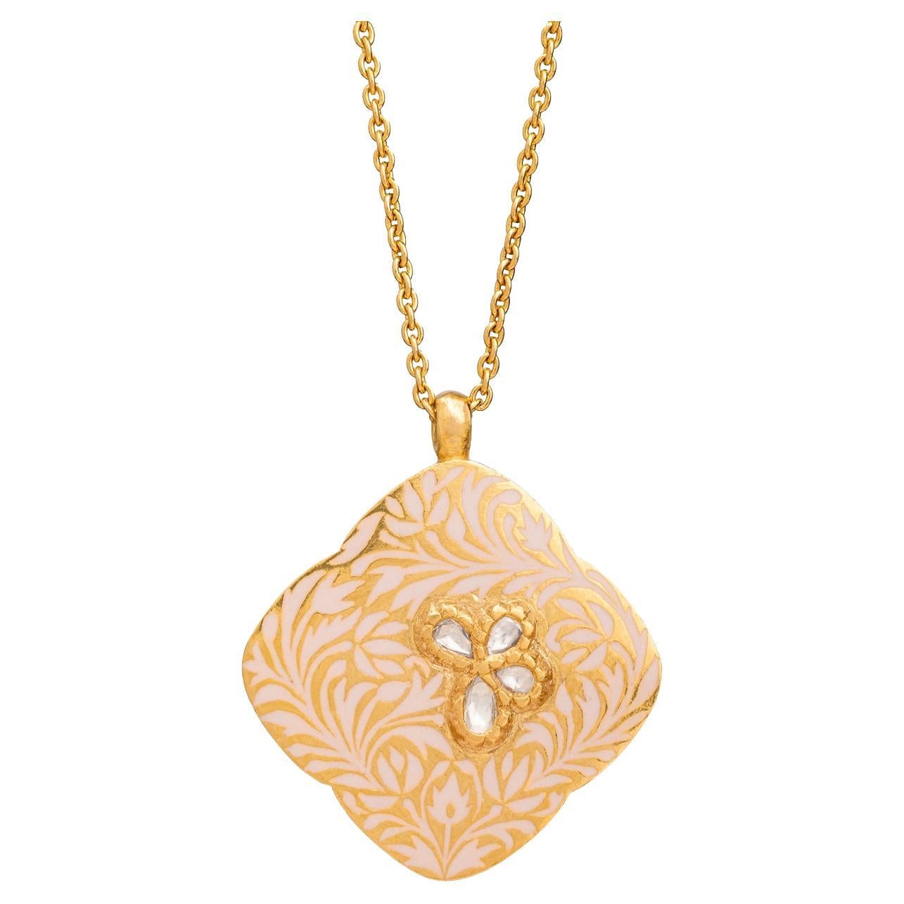 A butterfly in a garden.

This beautifully handcrafted clover pendant necklace called 'Rose Enigma' is from Agaro Jewels' Roya collection. Roya, meaning 'dreams' in Persian, is a collection of reversible pendants that are modern heirlooms made with