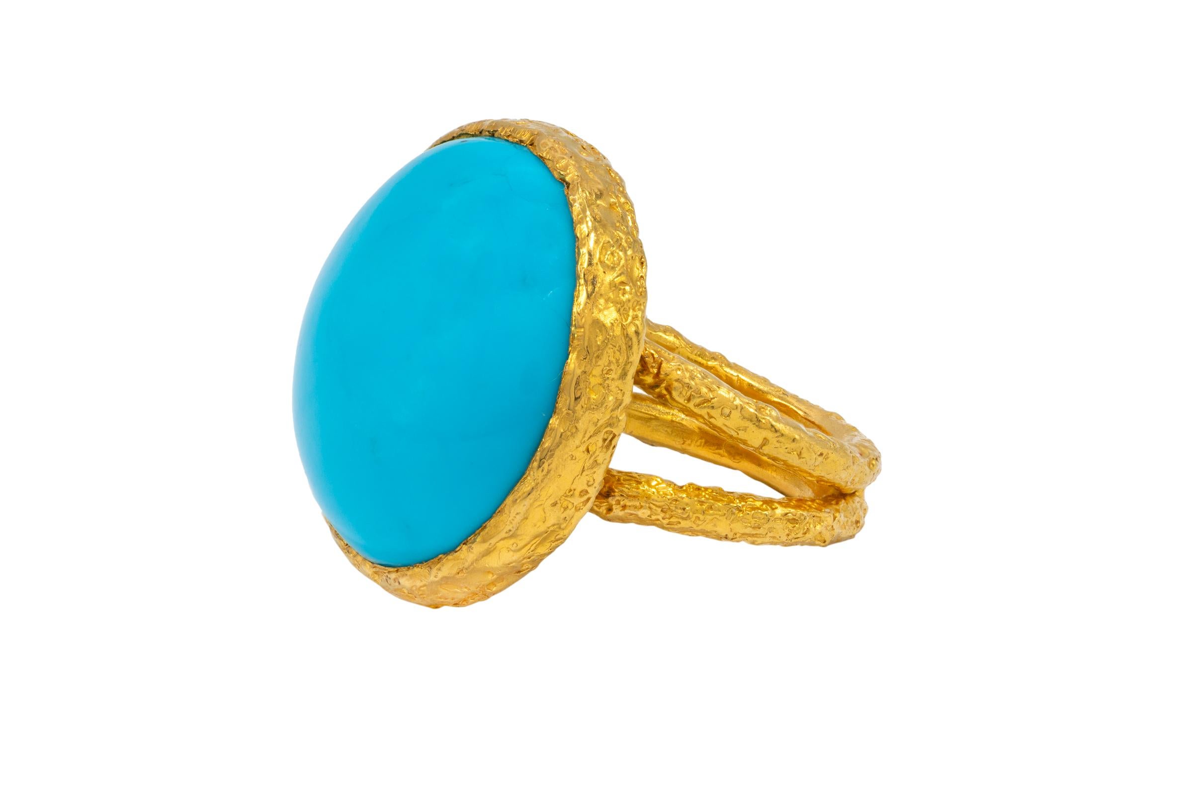 22k Gold Summer Signature Cocktail Ring featuring a beautiful large round turquoise stone surrounded by an organically textured bezel. With the combination of Tagili’s signature finish and the vibrant color of turquoise blended together,