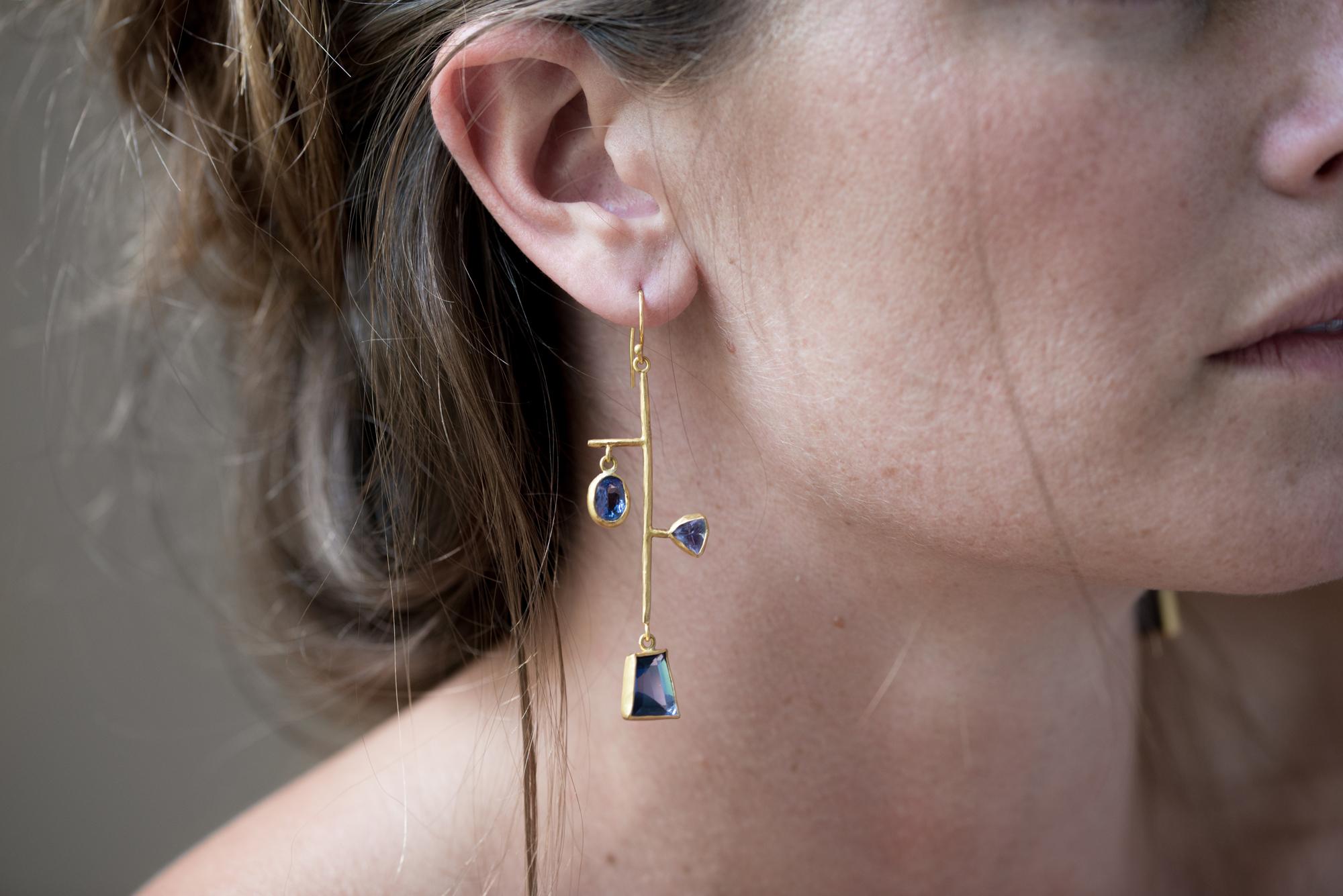One of a kind, faceted, deep, periwinkle blue tanzanite mobile earrings are completely hand crafted of 22k gold with bezel set tanzanite. 18k Gold ear wires for pierced ears. Inspired by mid century design, this pair is truly, art to wear.

11.04