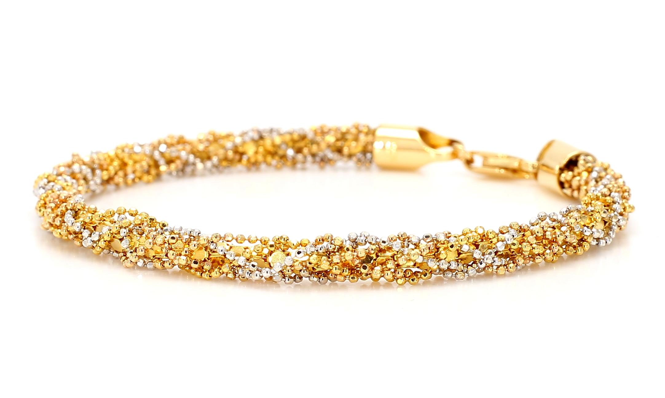 A very unique Tri-Tone Gold intertwined bracelet manufactured in Dubai.

Stamped 22K

22K Yellow Gold
18K Rose Gold
18K White Gold

7 inches
(17.78 cm)

12.60 Grams Total
