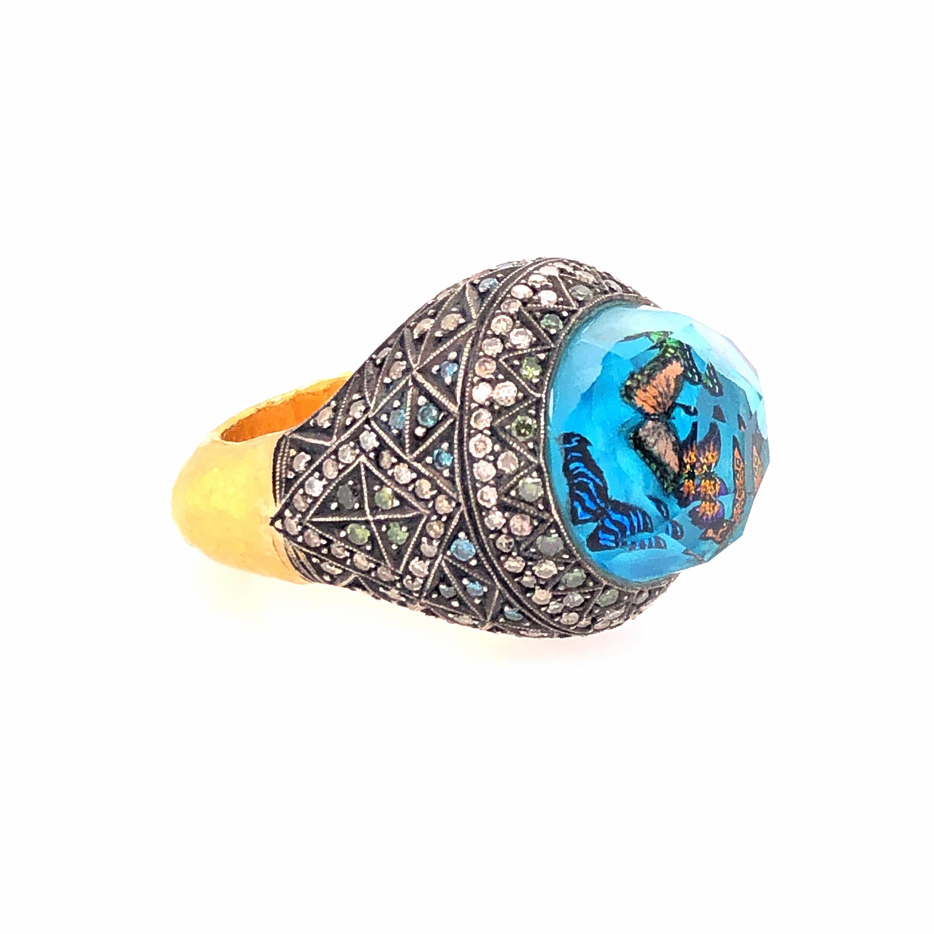 Masterfully crafted butterflies are layered in the carved centerpiece while diamonds create geometric patterns around the shoulders of this thick 22Kyellow gold ring. 

Size: 7.5-8

