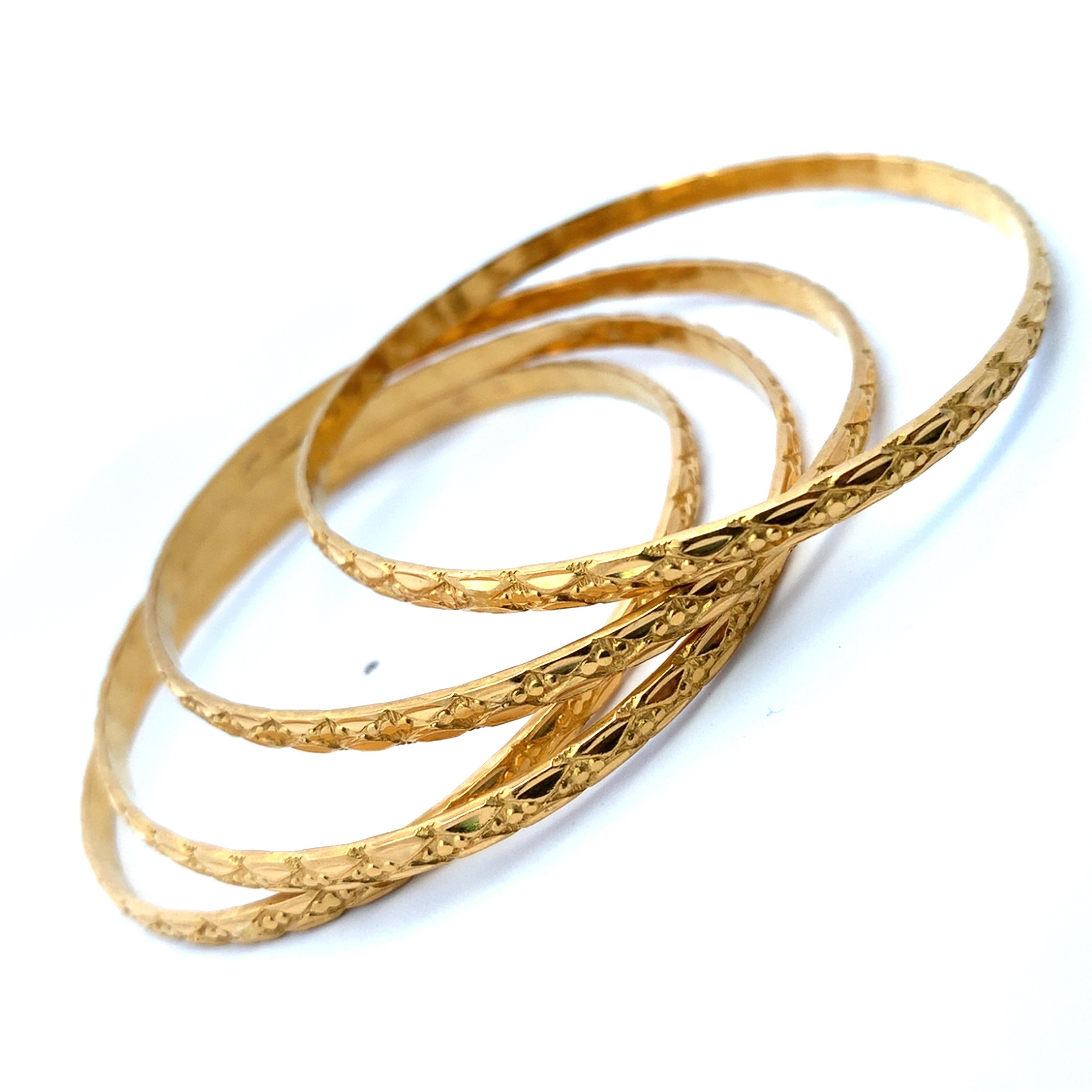 22k Yellow gold patterned matching bangle bracelets For Sale 2