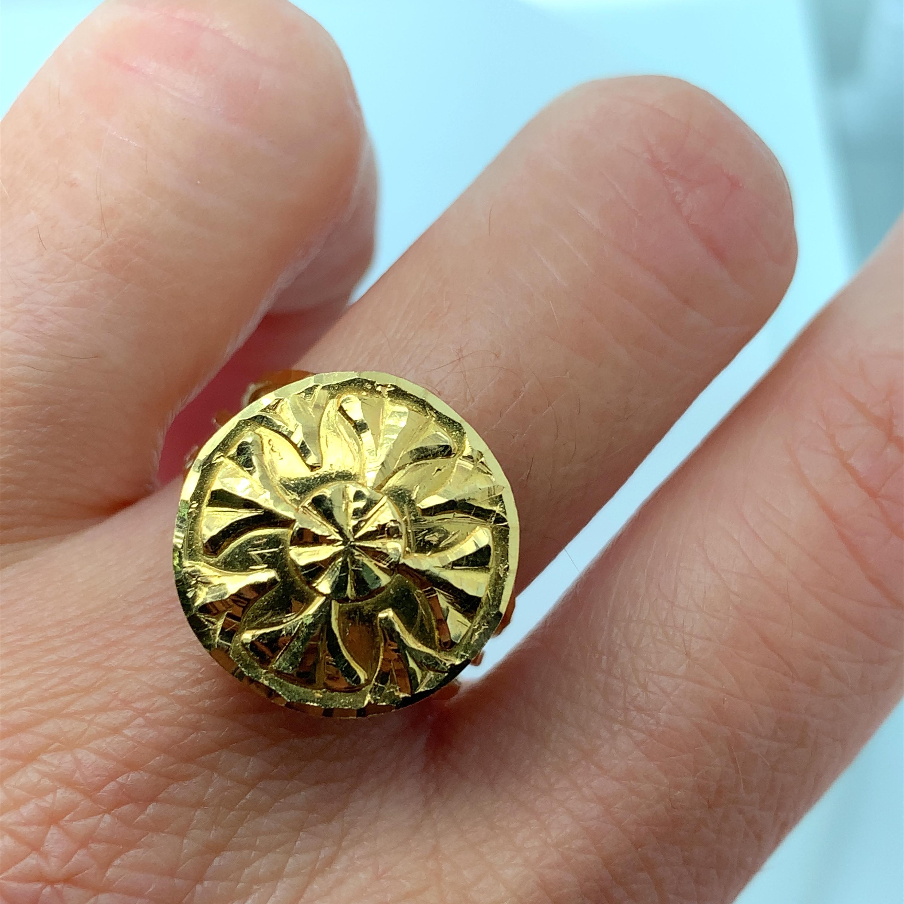 This exquisite signet ring or wedding band is crafted from 22ct yellow gold, making it a timeless piece that will last for generations to come. The chunky design adds a touch of elegance and sophistication to any outfit, making it perfect for an