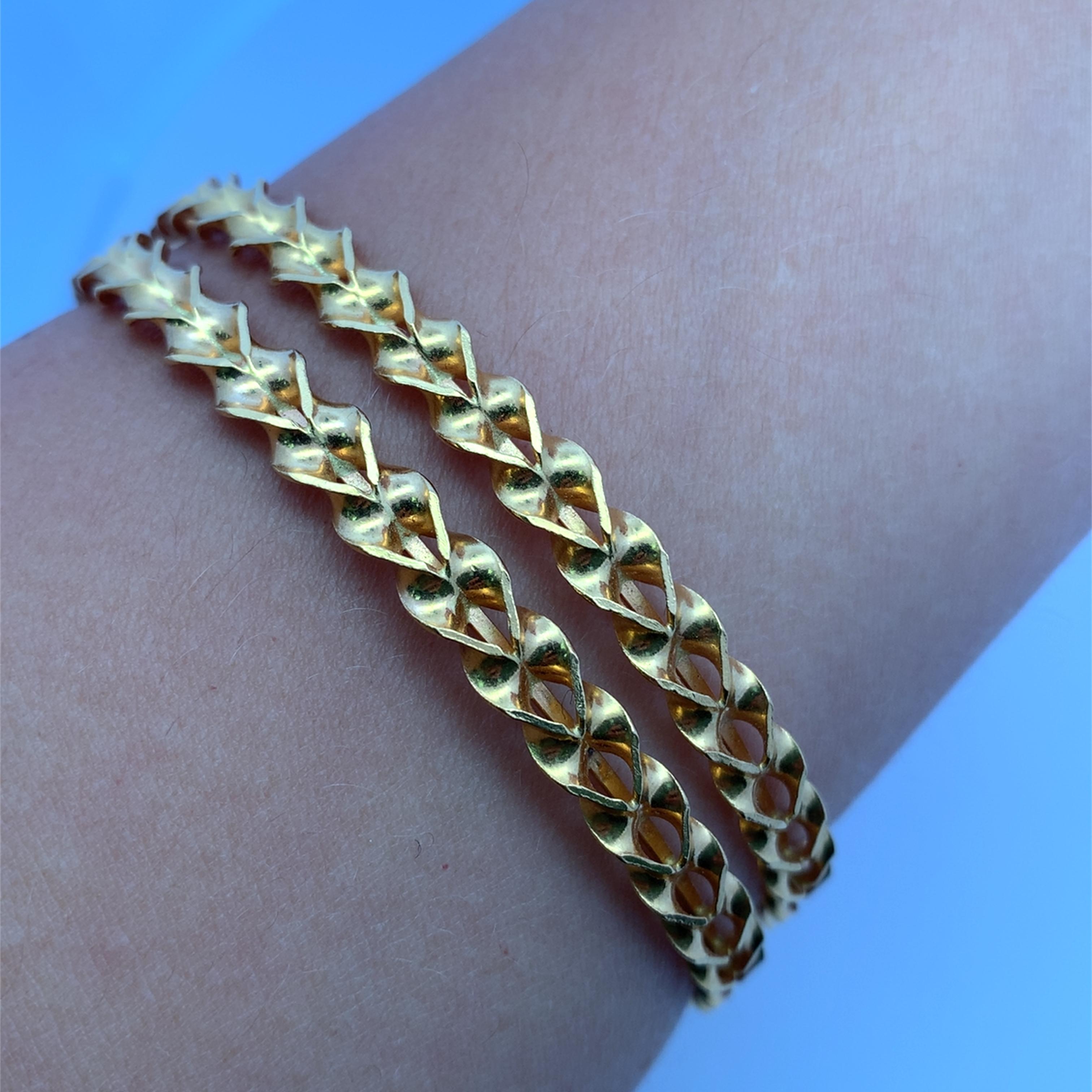 This elegant pure matching twisted cuff bracelet 22k yellow gold bangle bracelets showcases a meticulously crafted design. The continuous pattern offers a sleek and stylish aesthetic, perfect for adding a touch of sophistication to any ensemble. Its