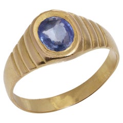 22KT.  bague homme en or jaune 0,75 cts de saphir bleu. 