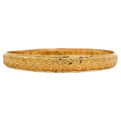 22kYellow gold patterned chunky bangle bracelet