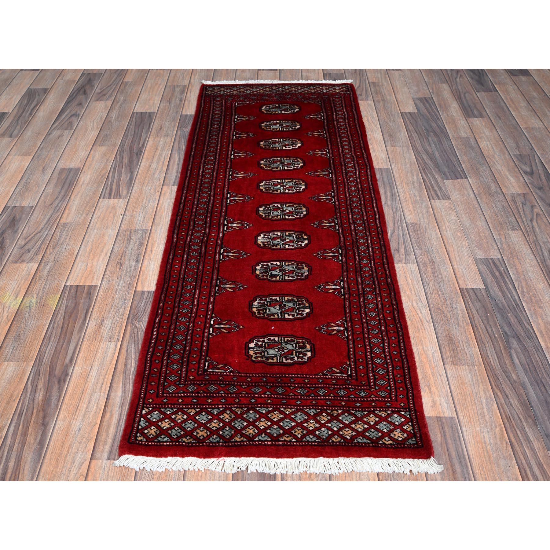 Arsenal Red, Princess Bokara with Geometric Medallions, Hand Knotted, Vegetable Dyes, Soft and Vibrant Wool, Short & Narrow Runner, Oriental Rug
Primary materials: Wool
Latex: No Pile 
height: 0.25 Inches
Style: Traditional
Primary color: