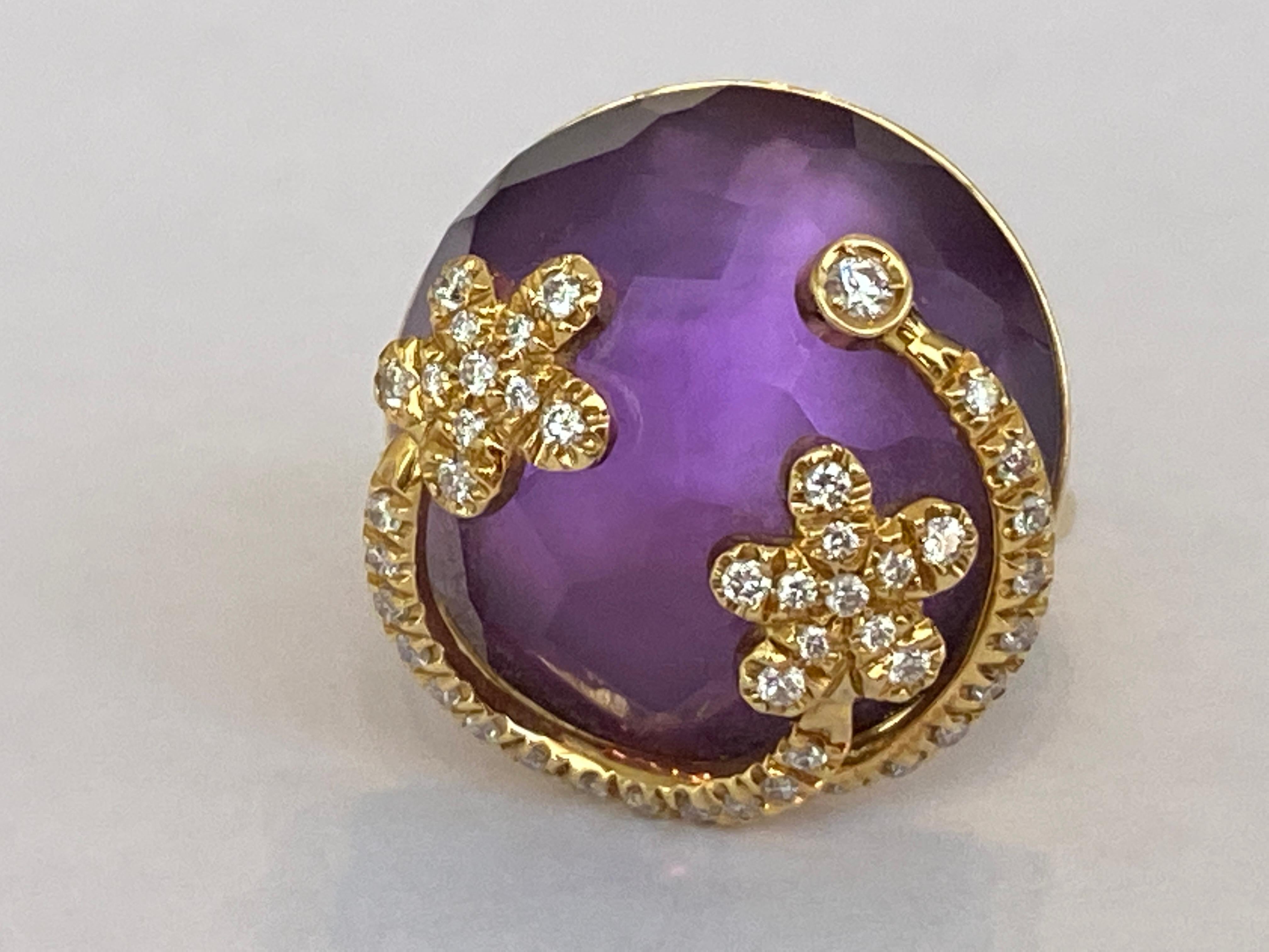 This ring is beyond stunningly beautiful and made of 18 kt  Yellow Gold.  Fantasy shape  amethyst stone decorated with garlands of  high quality diamonds approx. 0.65 ct G/VS/SI.  The ring has stamps and numbered. 
Weight of the ring: 15.8 gram
High