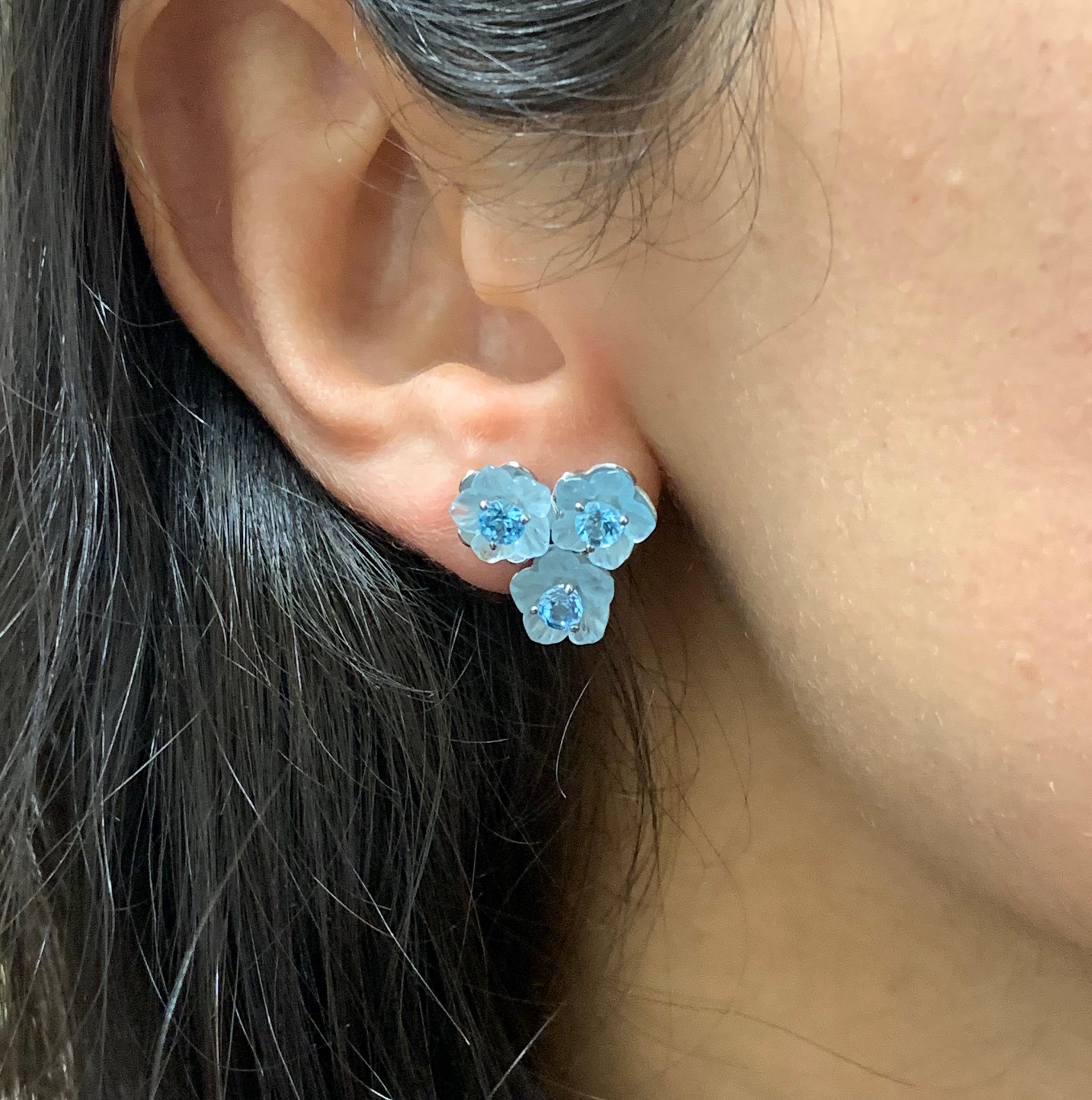 Material: 14k White Gold 
Center Stone Details: 6 Flower Blue Topaz's at 2.30 Carats
Surrounding Stone Details: 6 Round Blue Topaz's at 1.50 Carats 
Pair This With Our 8.75 Carat Blue Topaz and Diamond Flower Necklace, a perfect match!

Fine