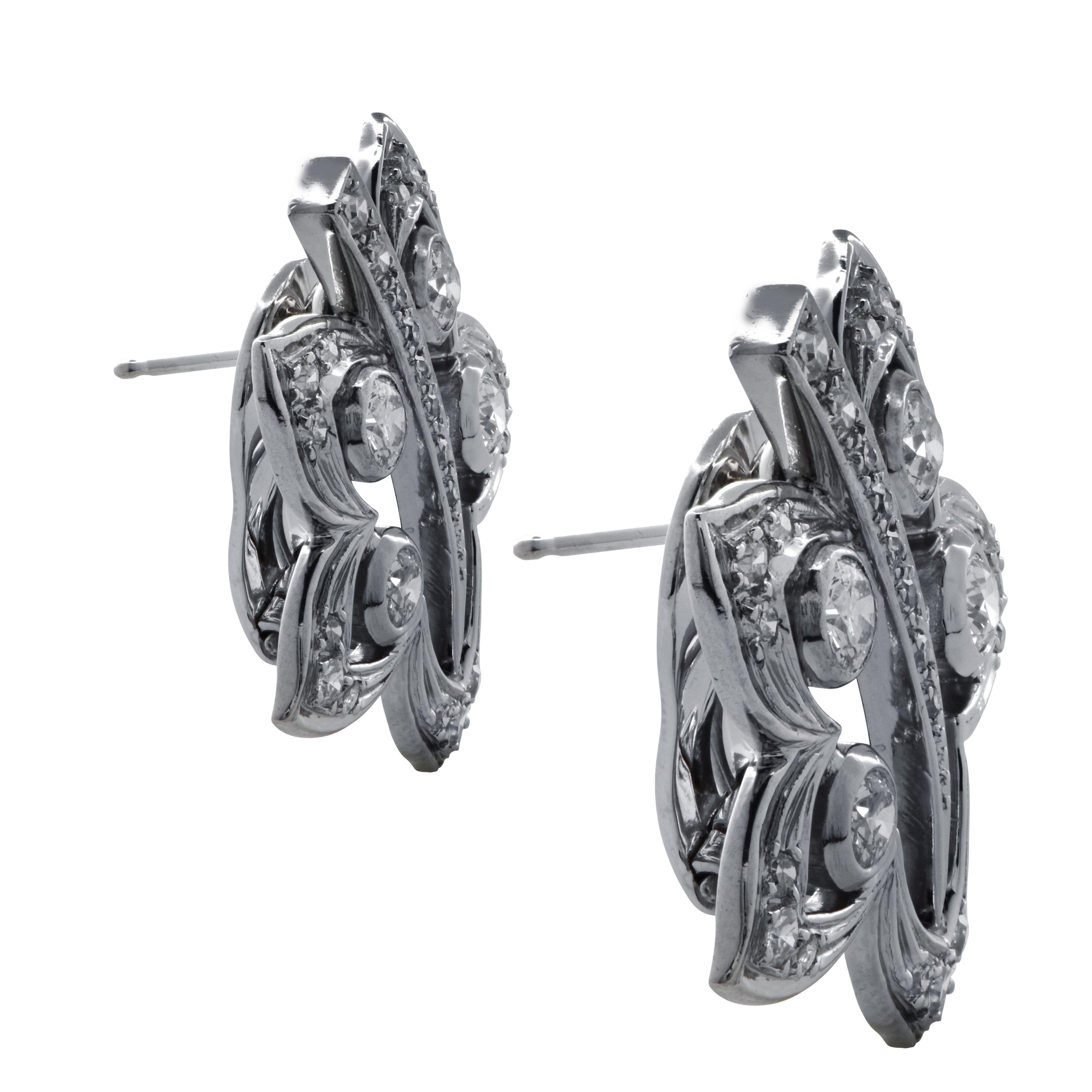 Beautiful earrings crafted in 18 karat white gold featuring 54 round brilliant and single cut diamonds weighing approximately 2.3 carats total, G color, VS-SI clarity, set in delightful flowers. These stunning earrings have posts and safety levers.